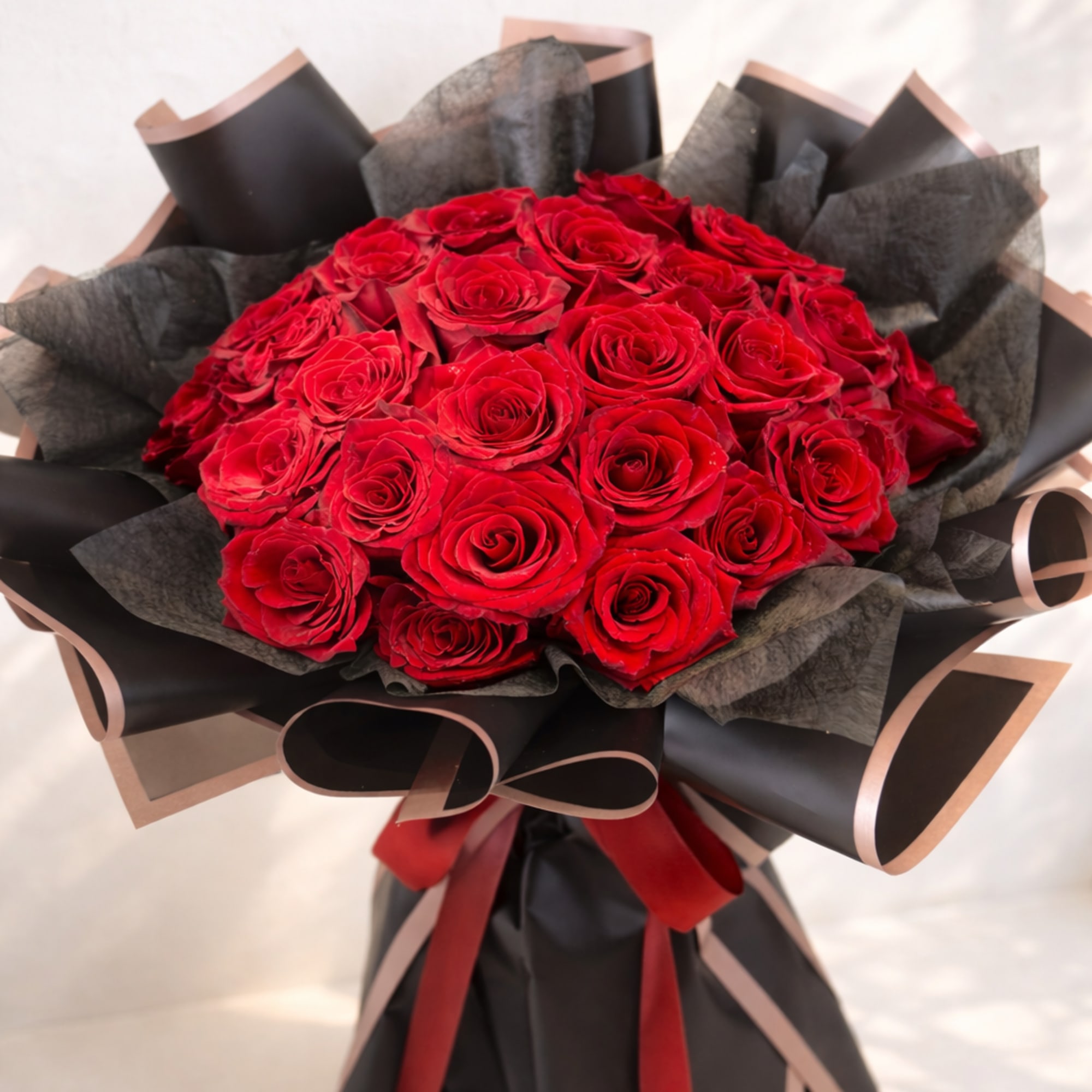 Midnight Romance Bouquet features a luxurious dome of premium red roses carefully