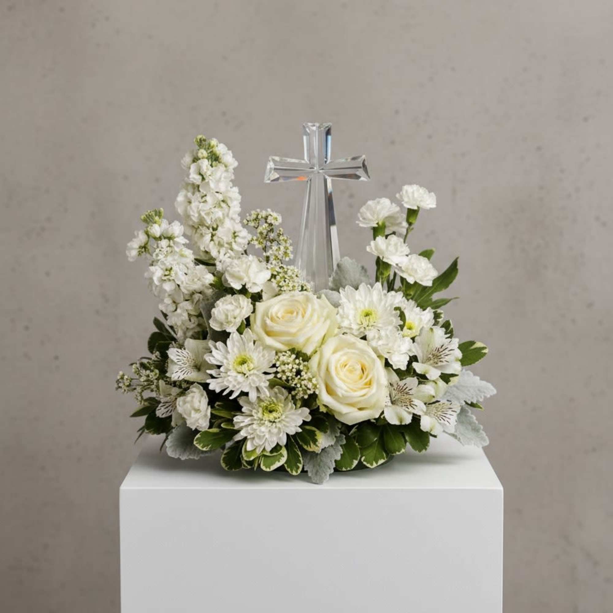 An elegant display of faith and divine peace, this beautiful arrangement will