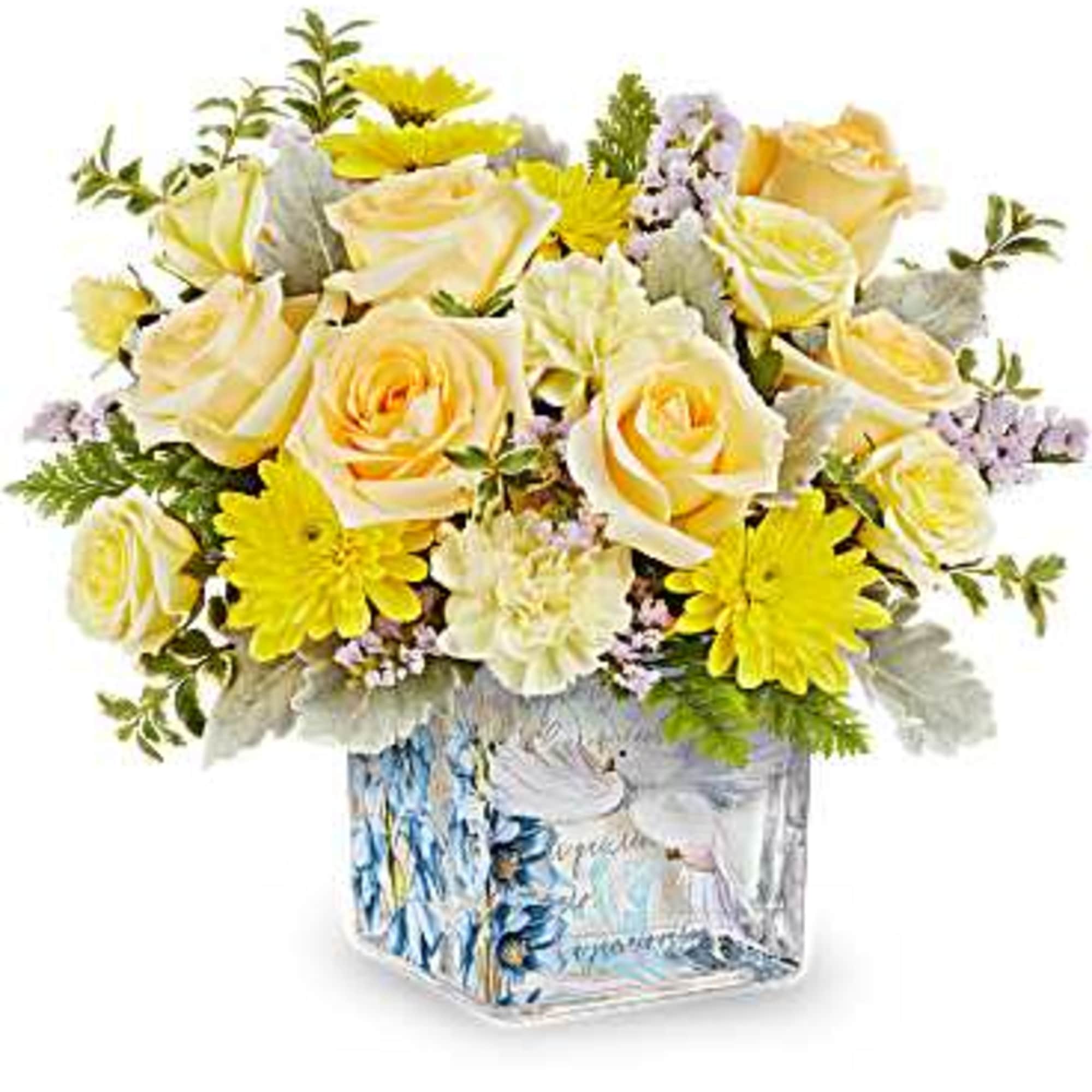 Glass cube with Dove decal filled with variety of yellow flowers and