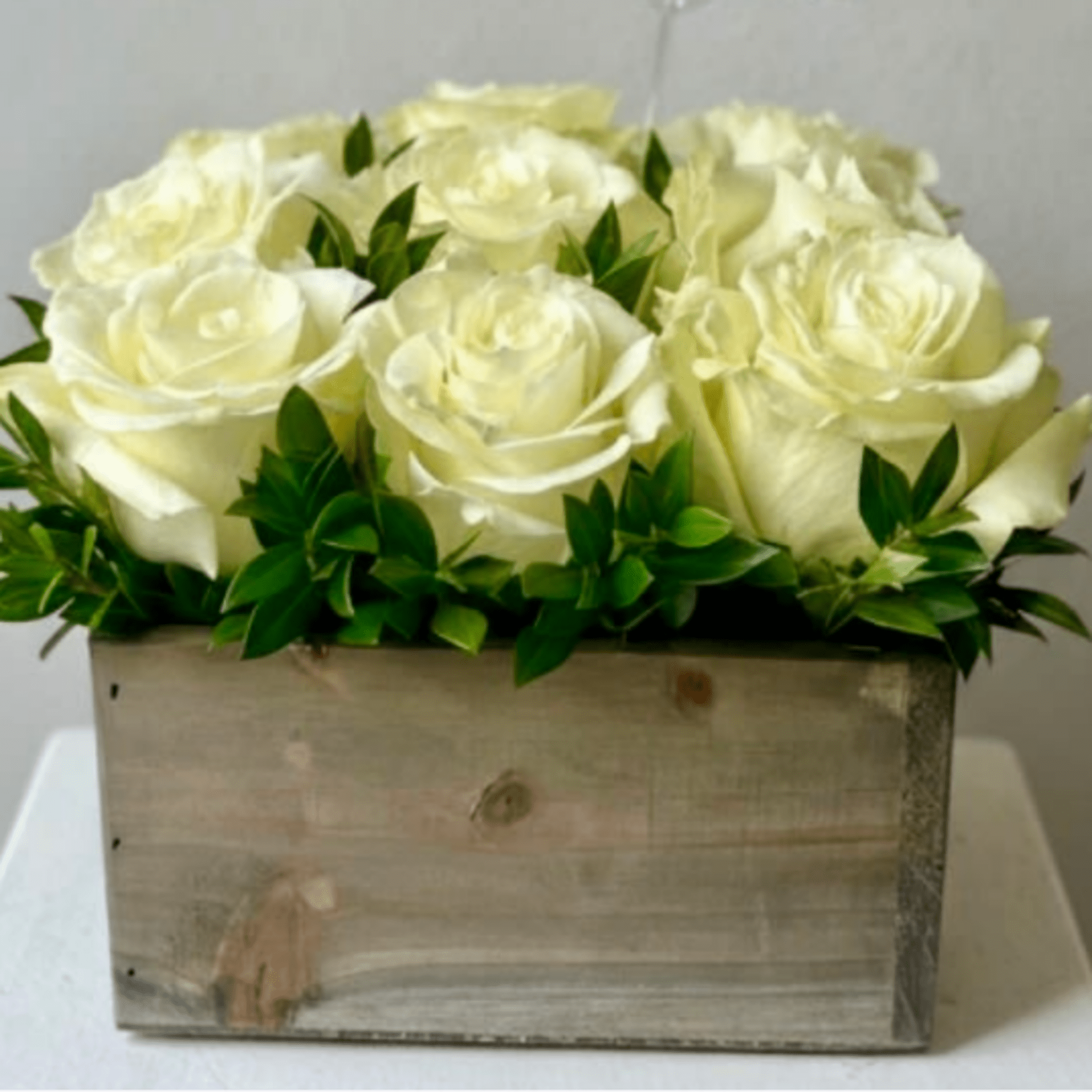 Trendy Box of Designer Big Head Roses available with greens in a