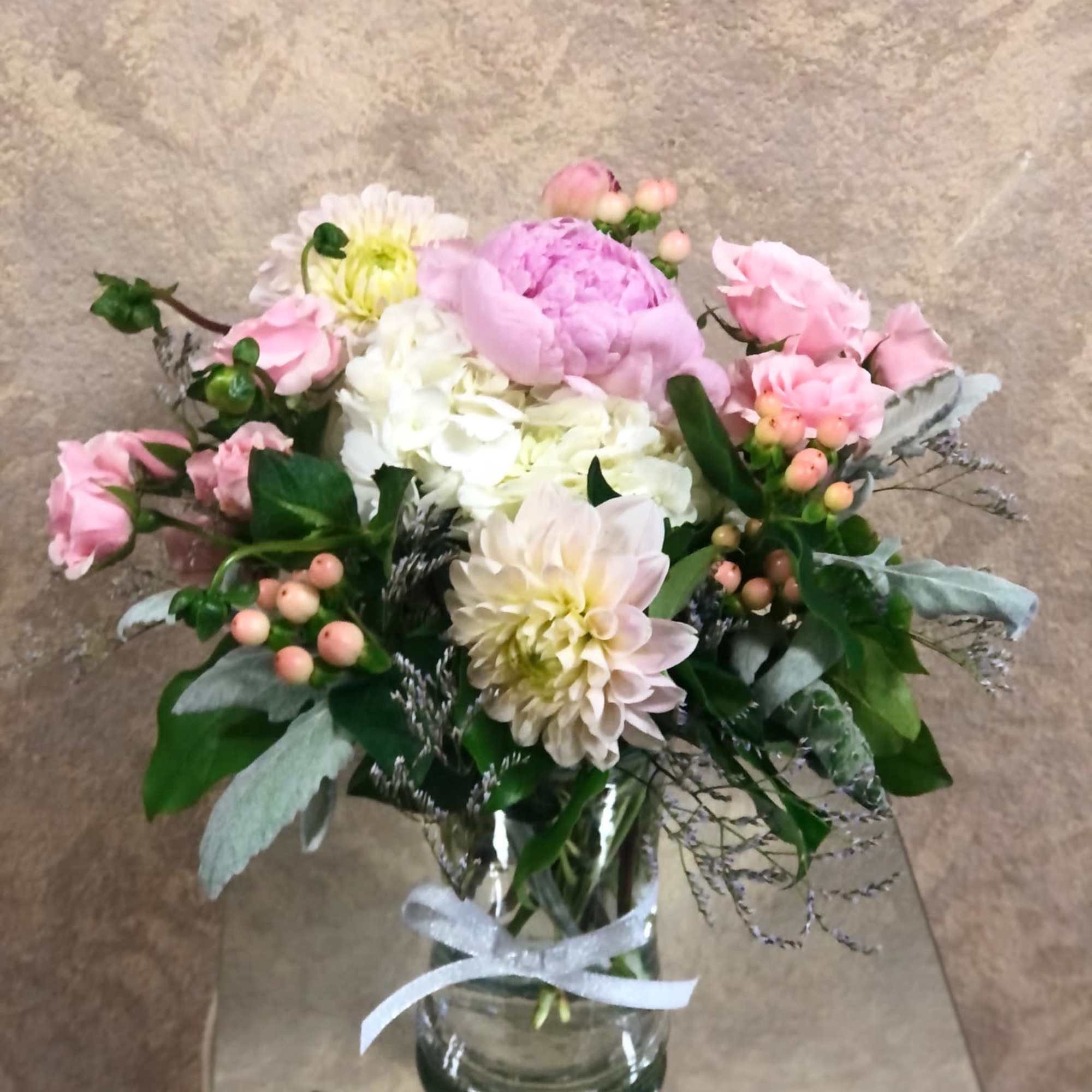 This bouquet is sweet and full of seasonal flowers that will surely