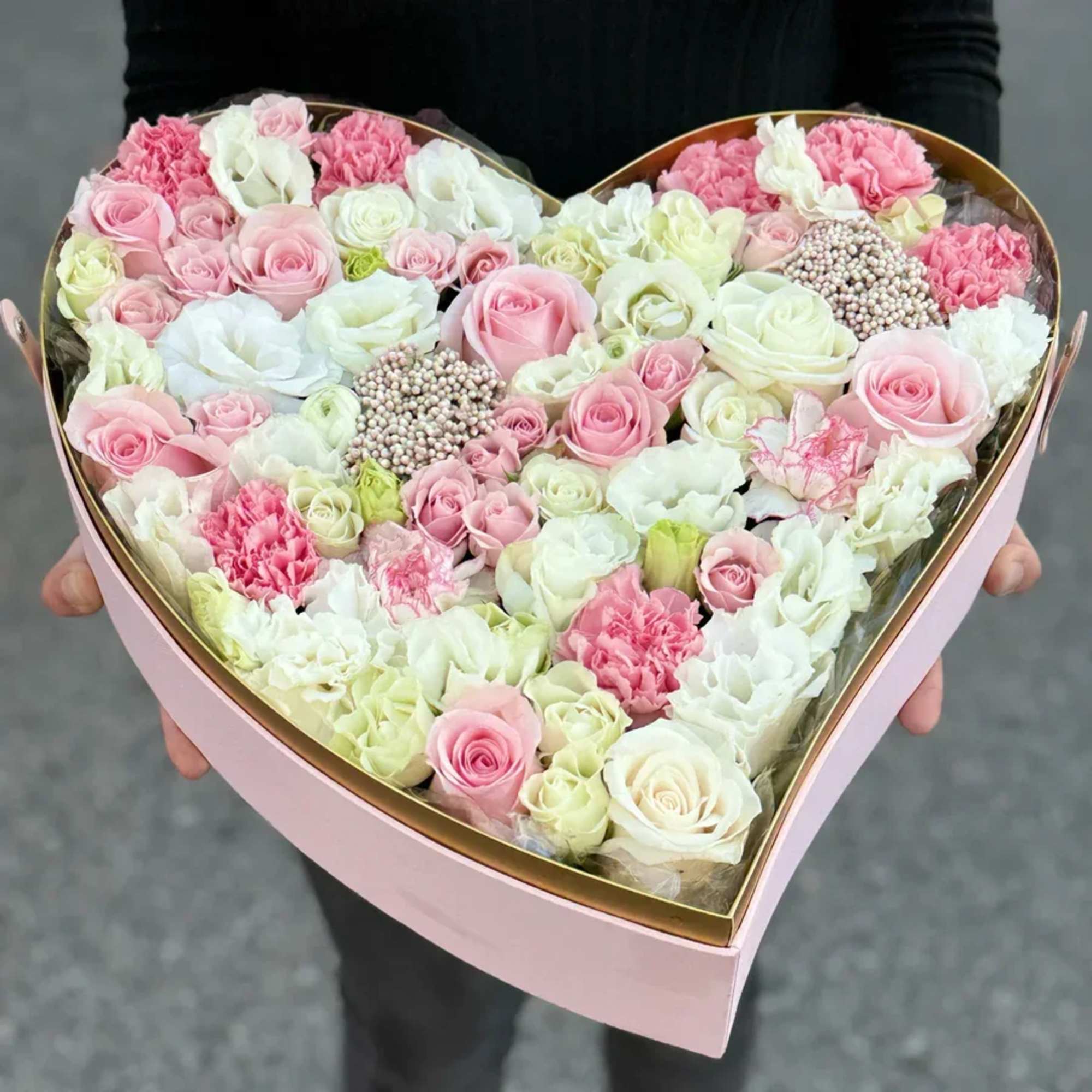 Make your day extra special with Charmed in Pink arrangement, filled with