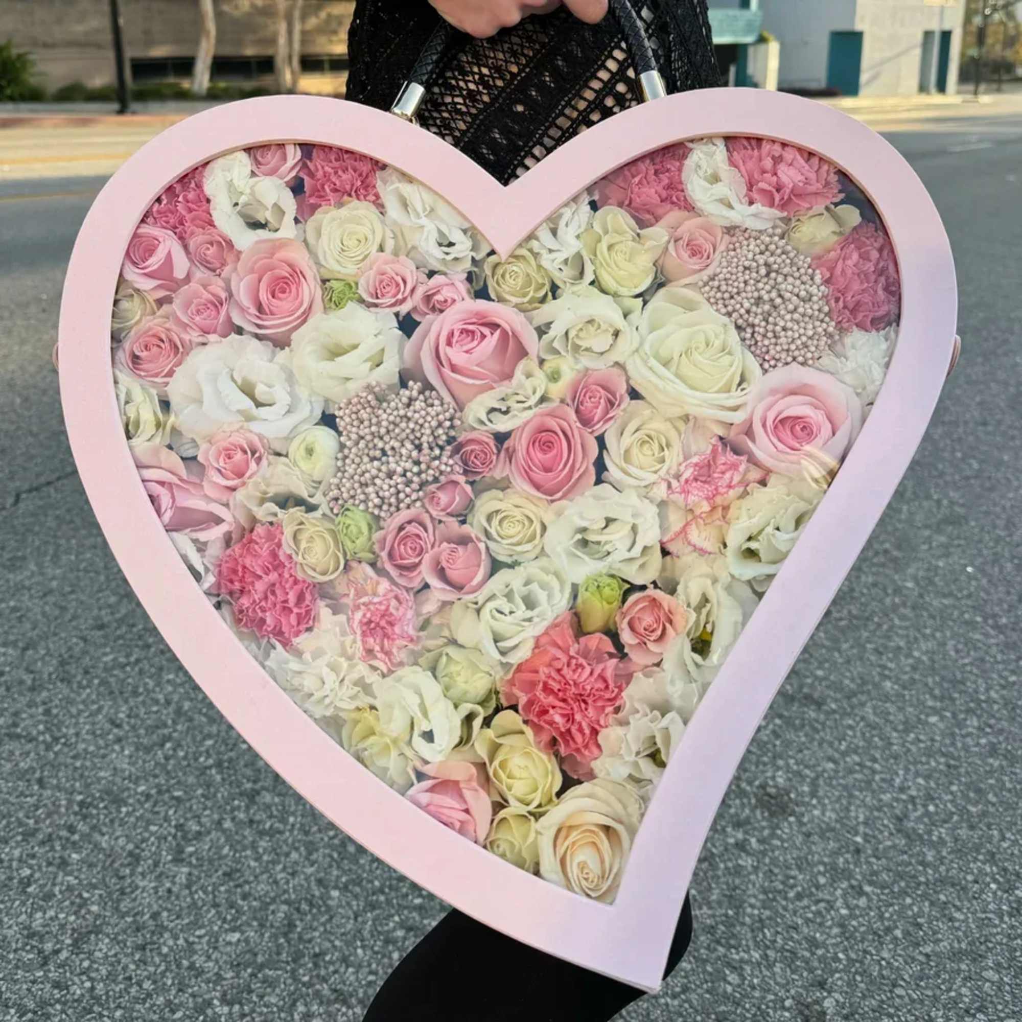 Make your day extra special with Charmed in Pink arrangement, filled with