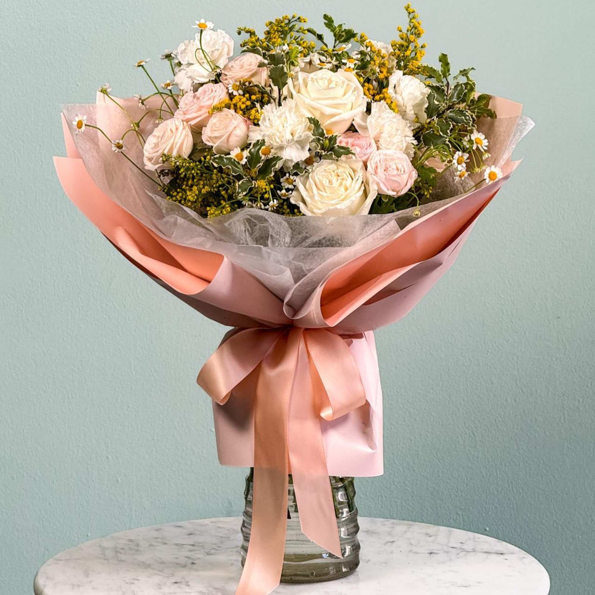 Rediscover the beauty of First Love with a timeless floral bouquet. This