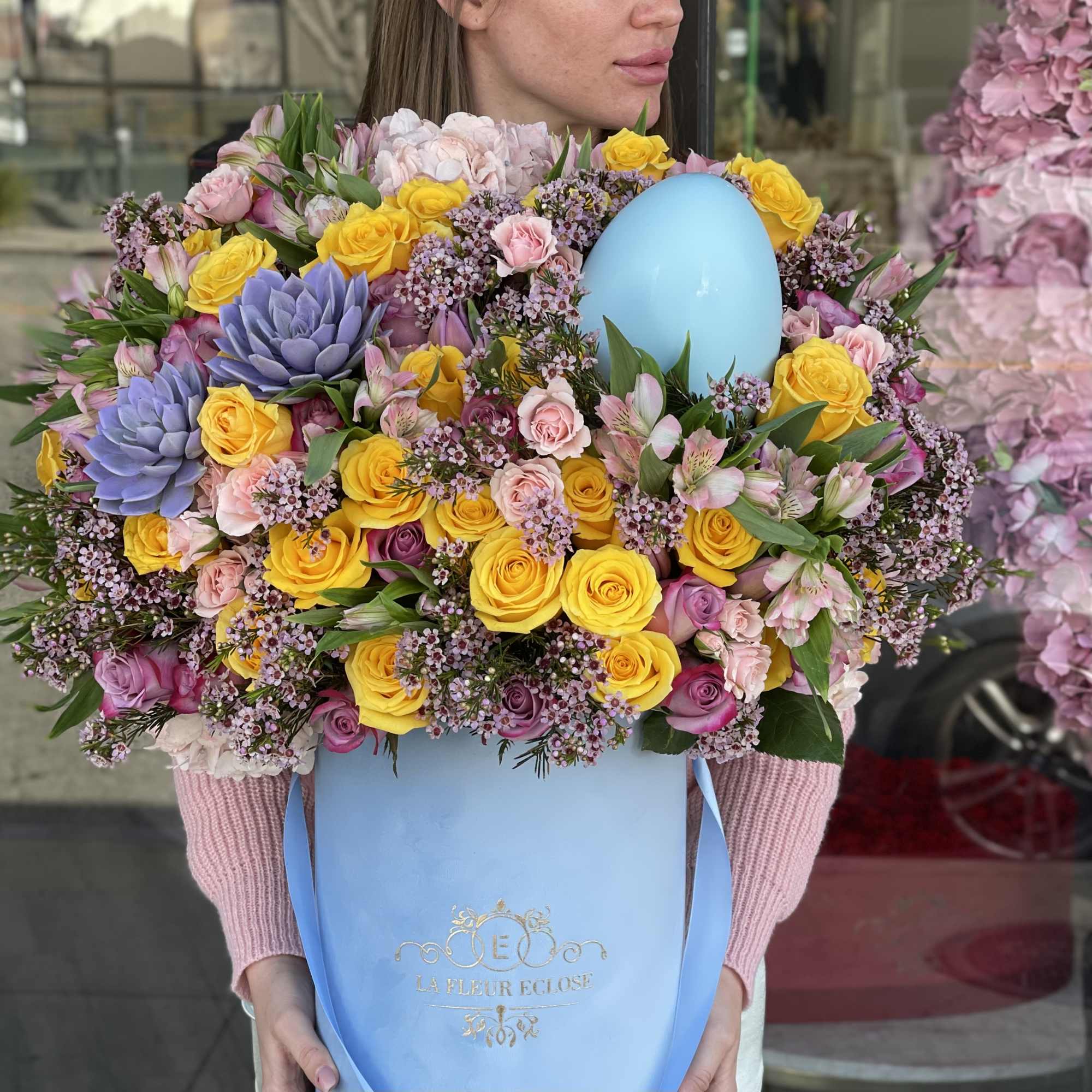 Introducing our Easter Delight Floral Arrangement, a whimsical and festive display that