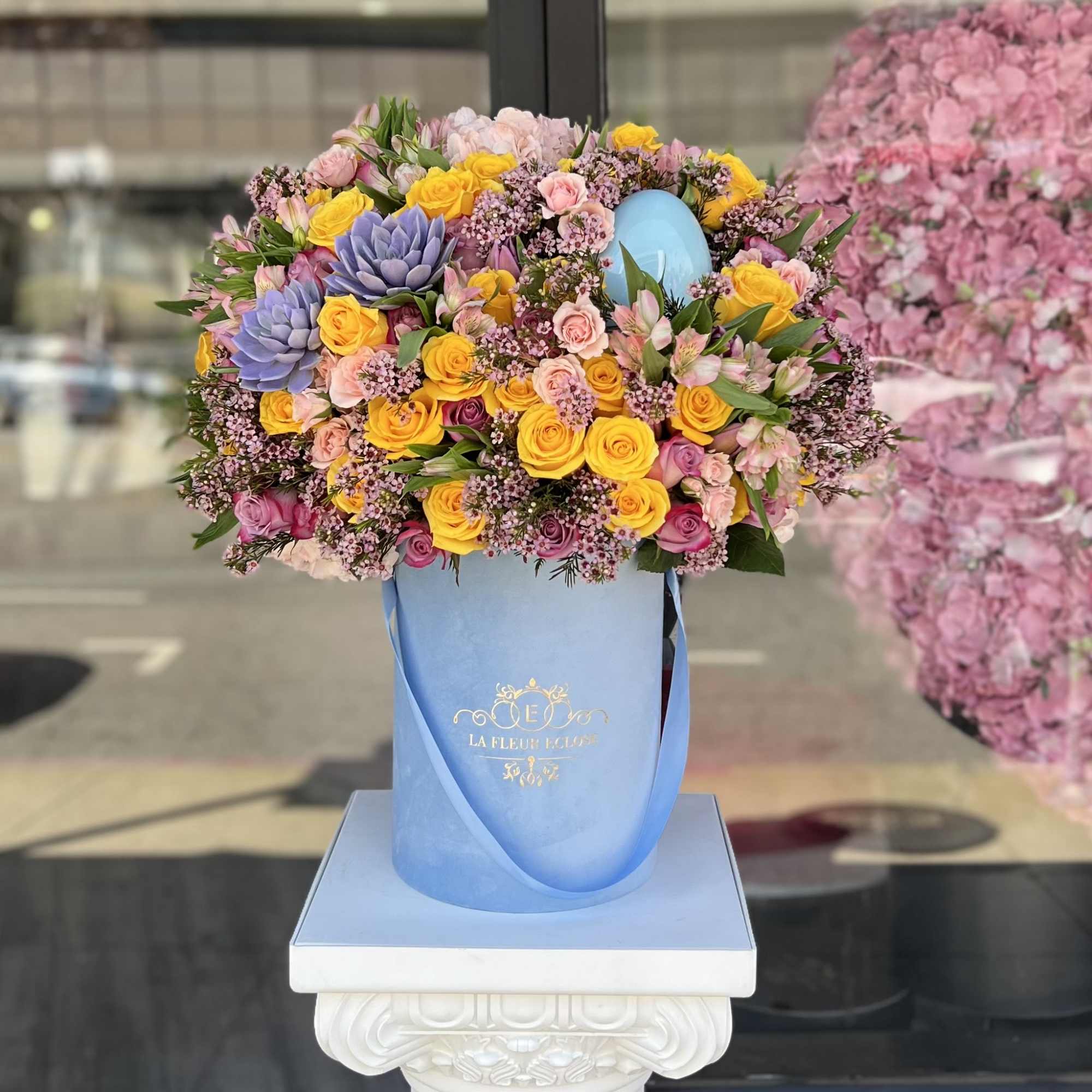 Introducing our Easter Delight Floral Arrangement, a whimsical and festive display that
