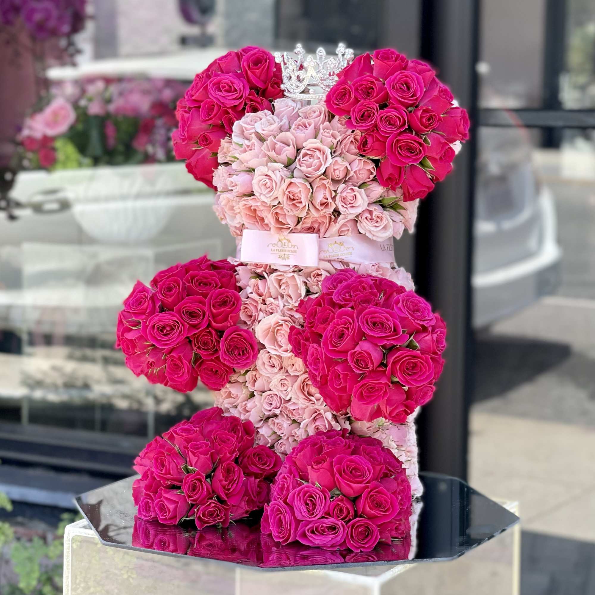 Bear with hot pink and light pink baby roses