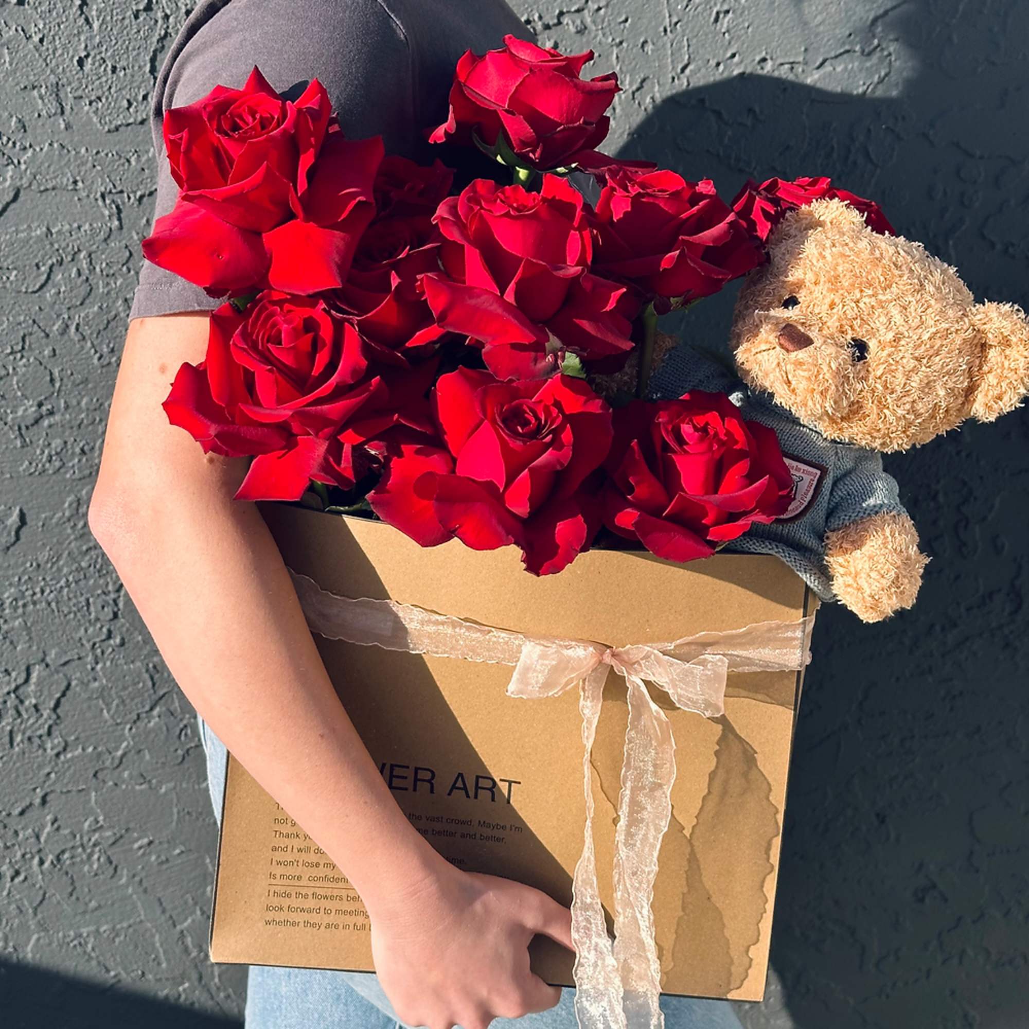 Discover timeless romance with our "Teddy in Love" arrangement&mdash;a captivating blend of