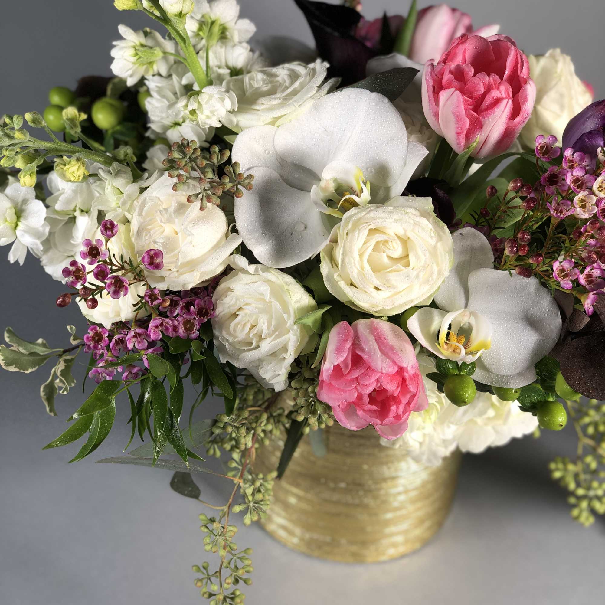 Full of fresh, beautiful blooms, this floral arrangement just like a gorgeous