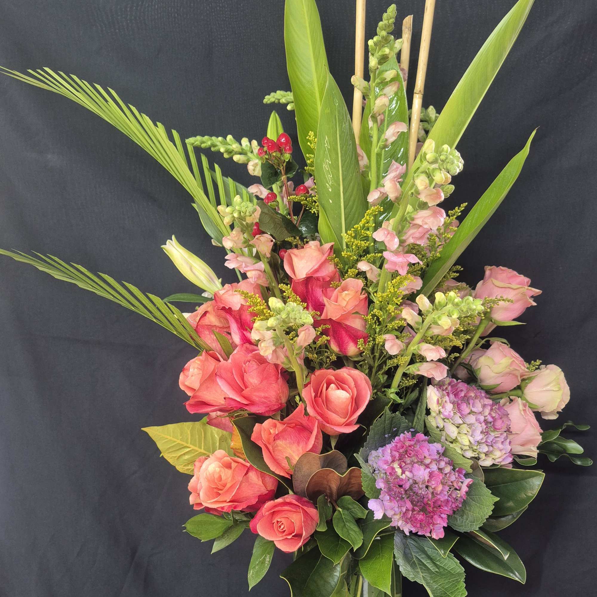 This stunning 360-degree arrangement stands approximately 28-30 ins tall and makes a