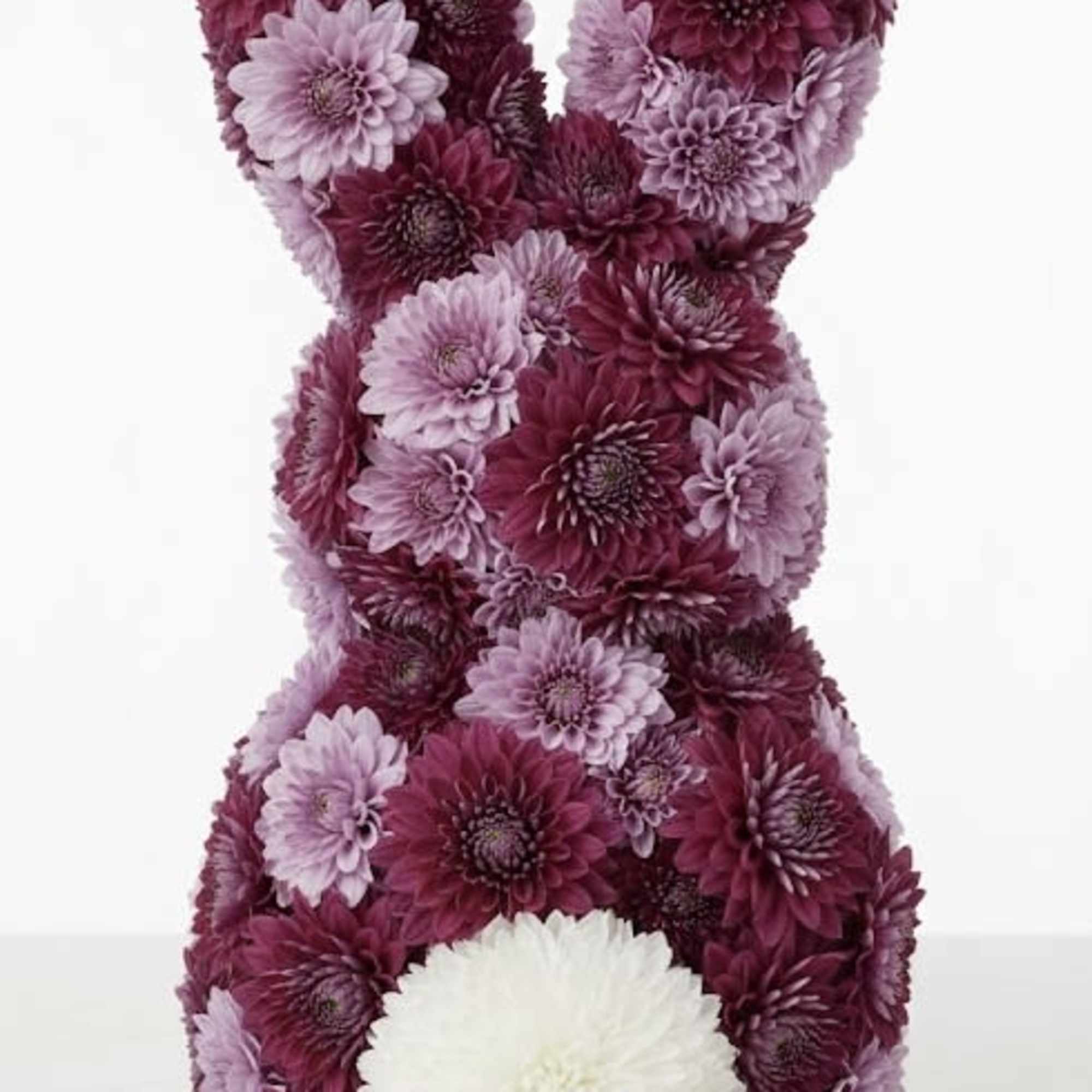 A sculptural floral bunny designed entirely from fresh seasonal blooms in rich