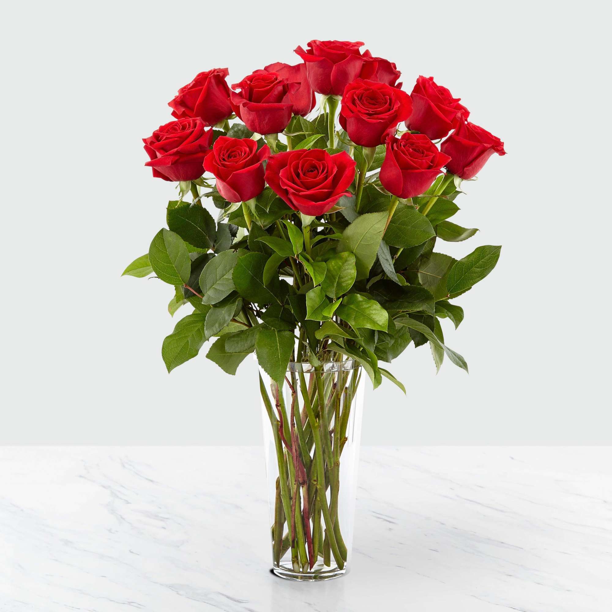 Indulge in the timeless elegance of our Long Stem Red Roses Bouquet