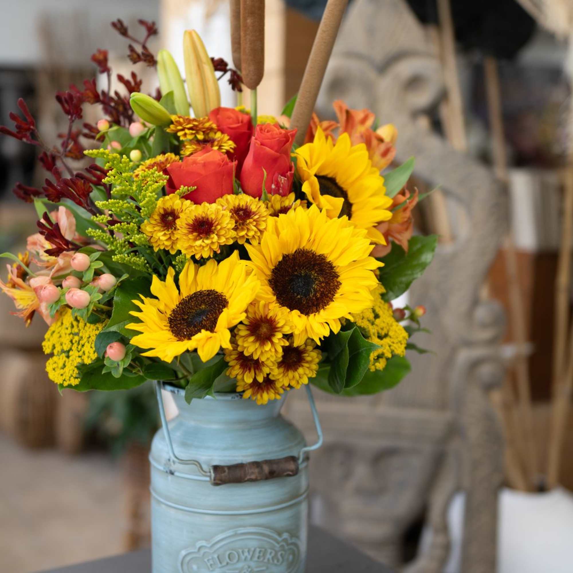 Mixed fall flowers in a milk jug.  Perfect for the fall.