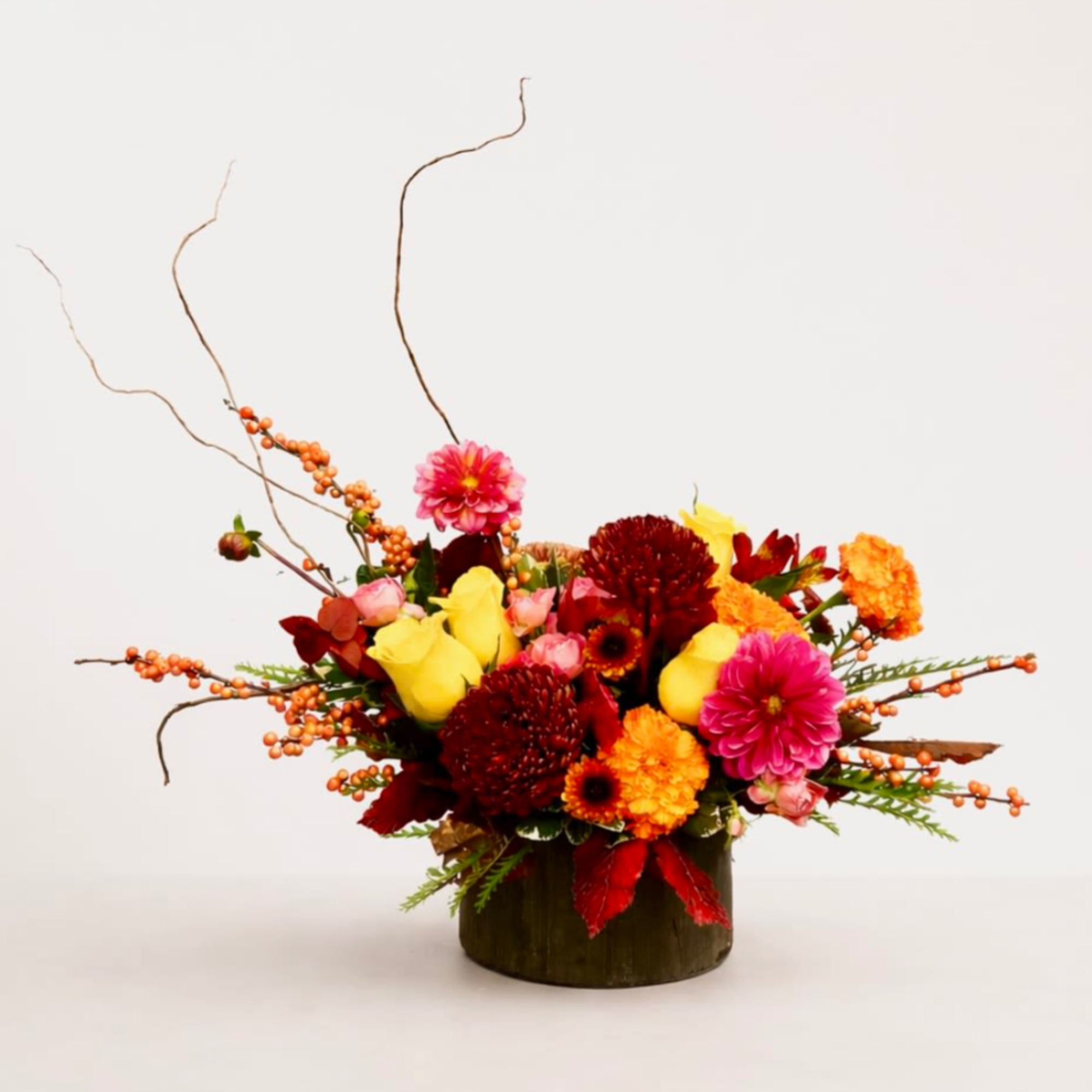 This arrangement radiates warmth and brightness &mdash; like a golden harvest catching