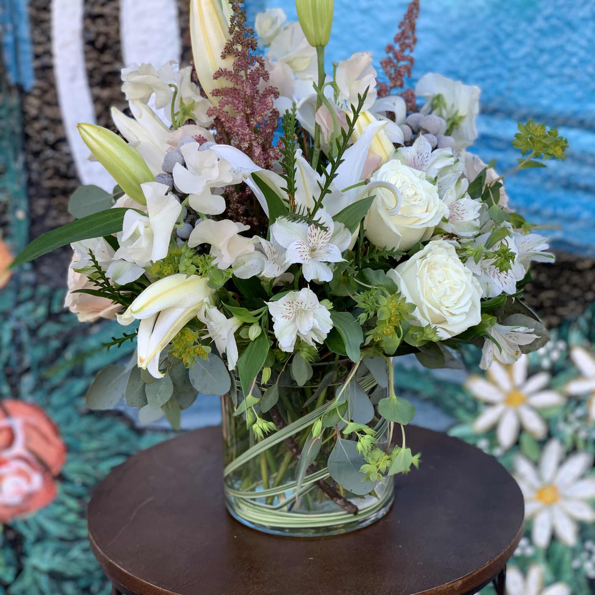 Seasonal flowers arranged in a vase. 