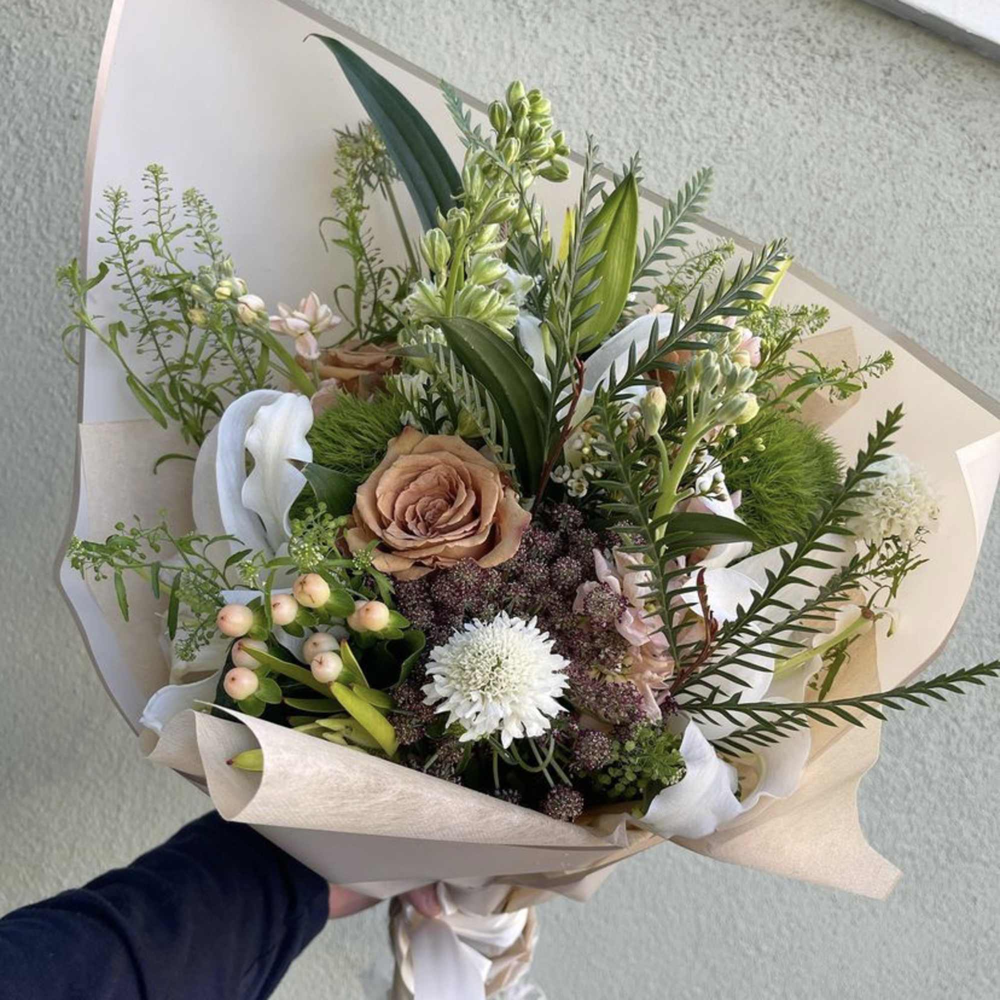Mix flowers in a hand-tied bouquet.