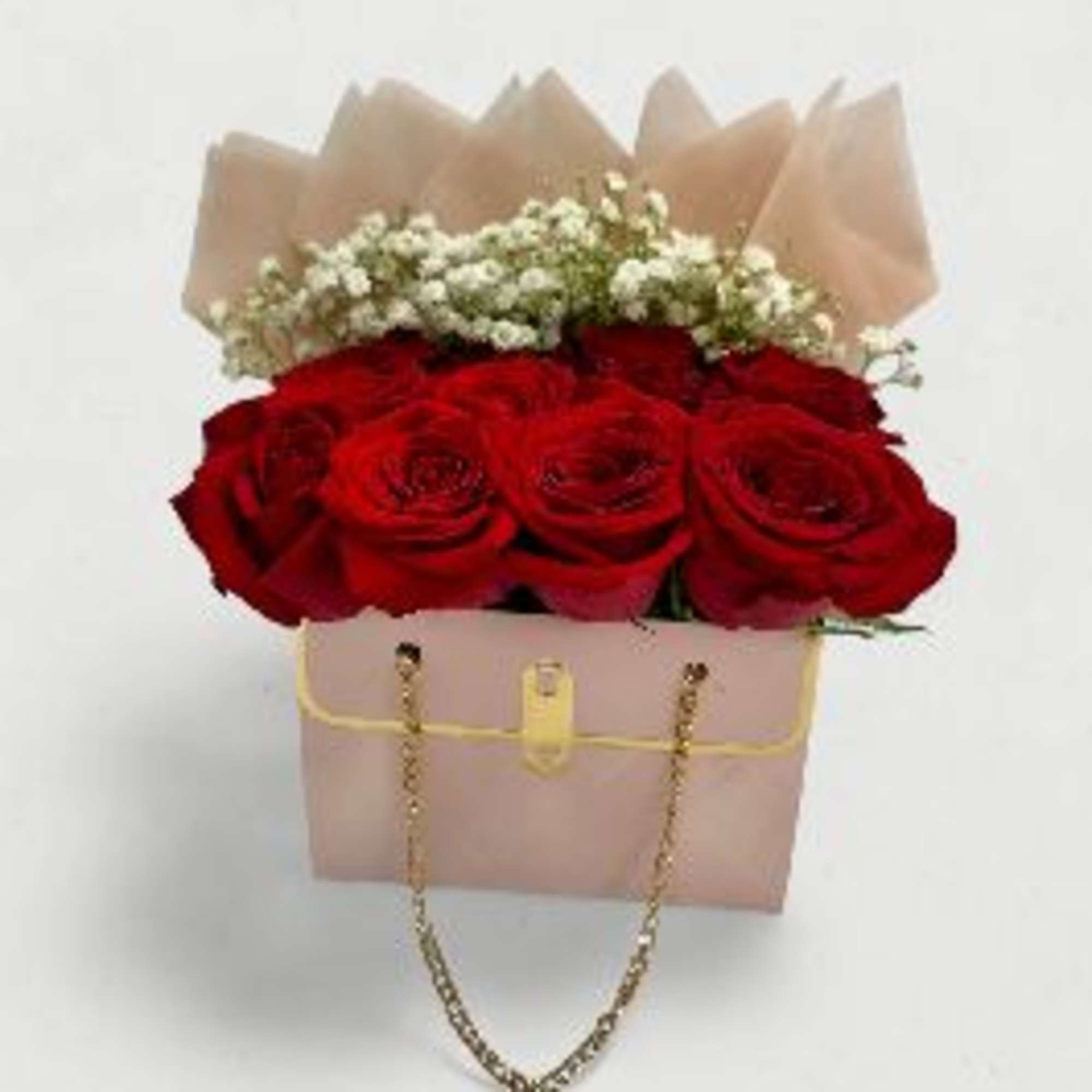 An exquisite arrangement of lush red roses and delicate baby&rsquo;s breath, beautifully