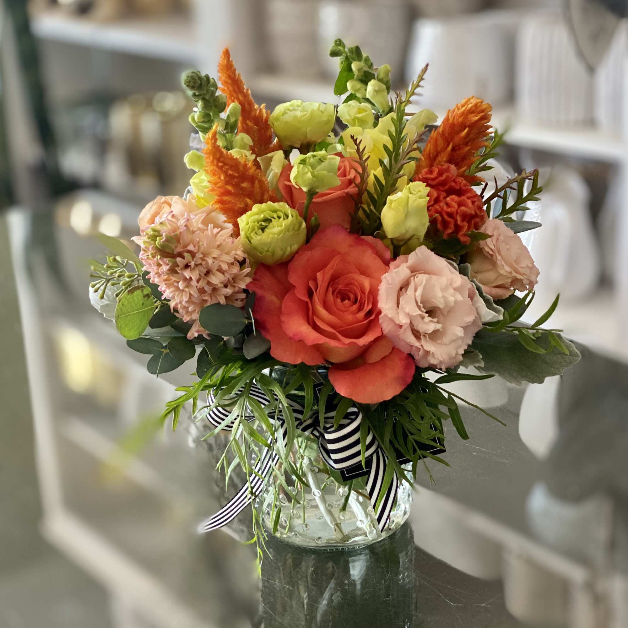 Welcome family and friends to the unique and stunning Sweet Citrus Arrangement!