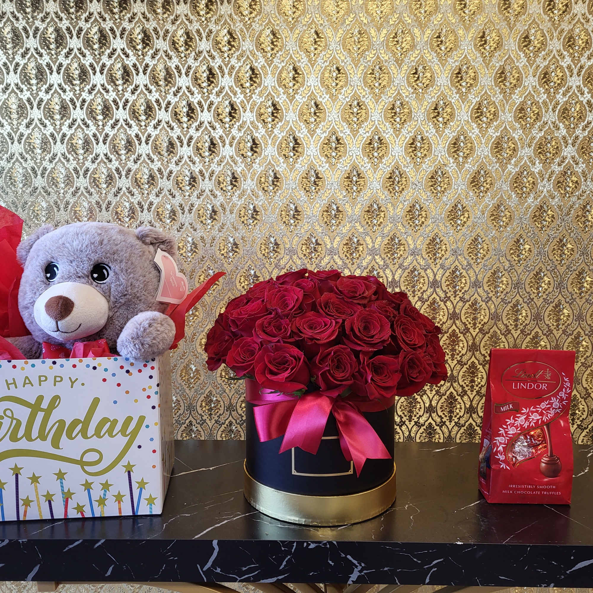 Featuring: Red Roses, Circle Box, Ribbon and a golden card with envelope