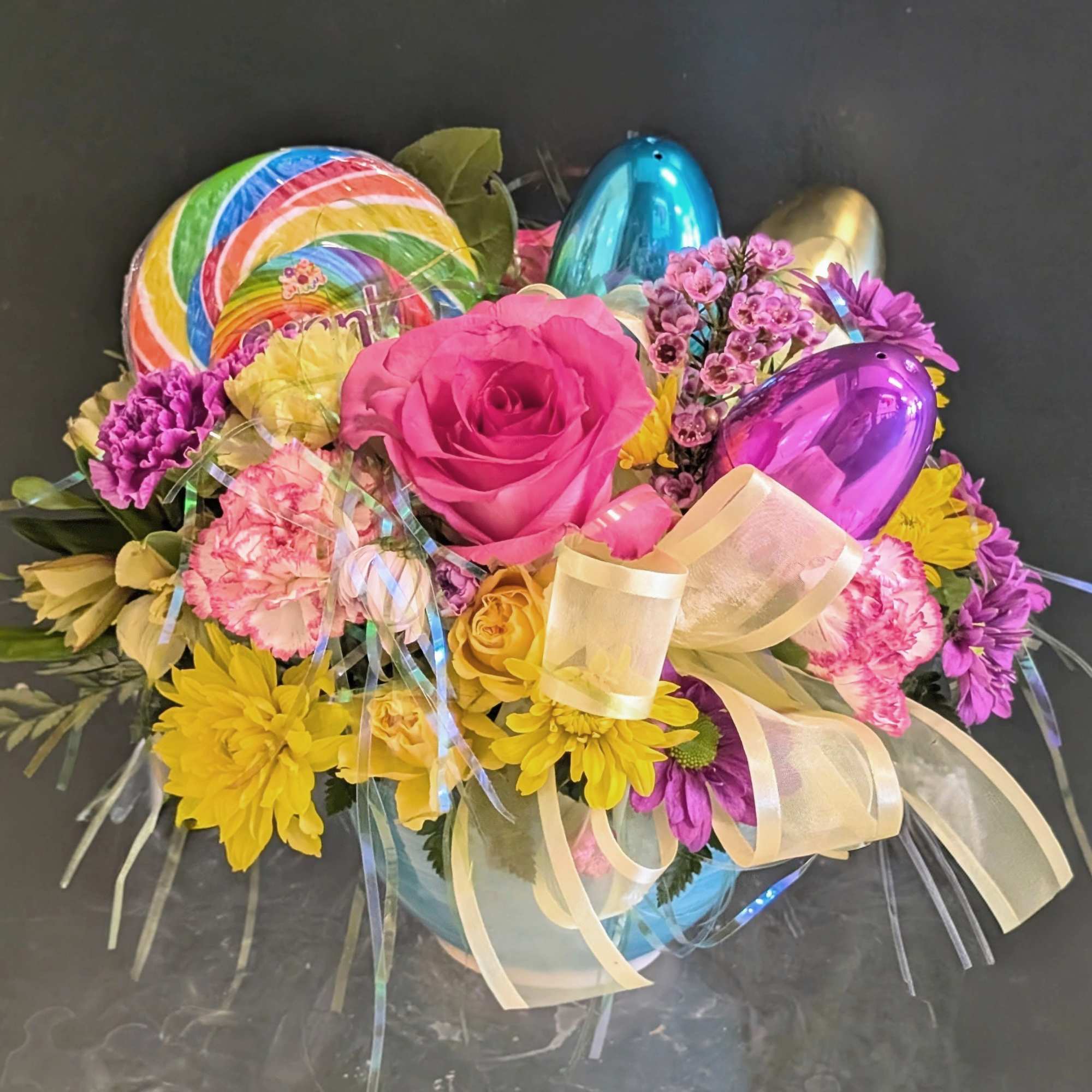 This arrangement is an adorably fun mix of Easter magic and floral
