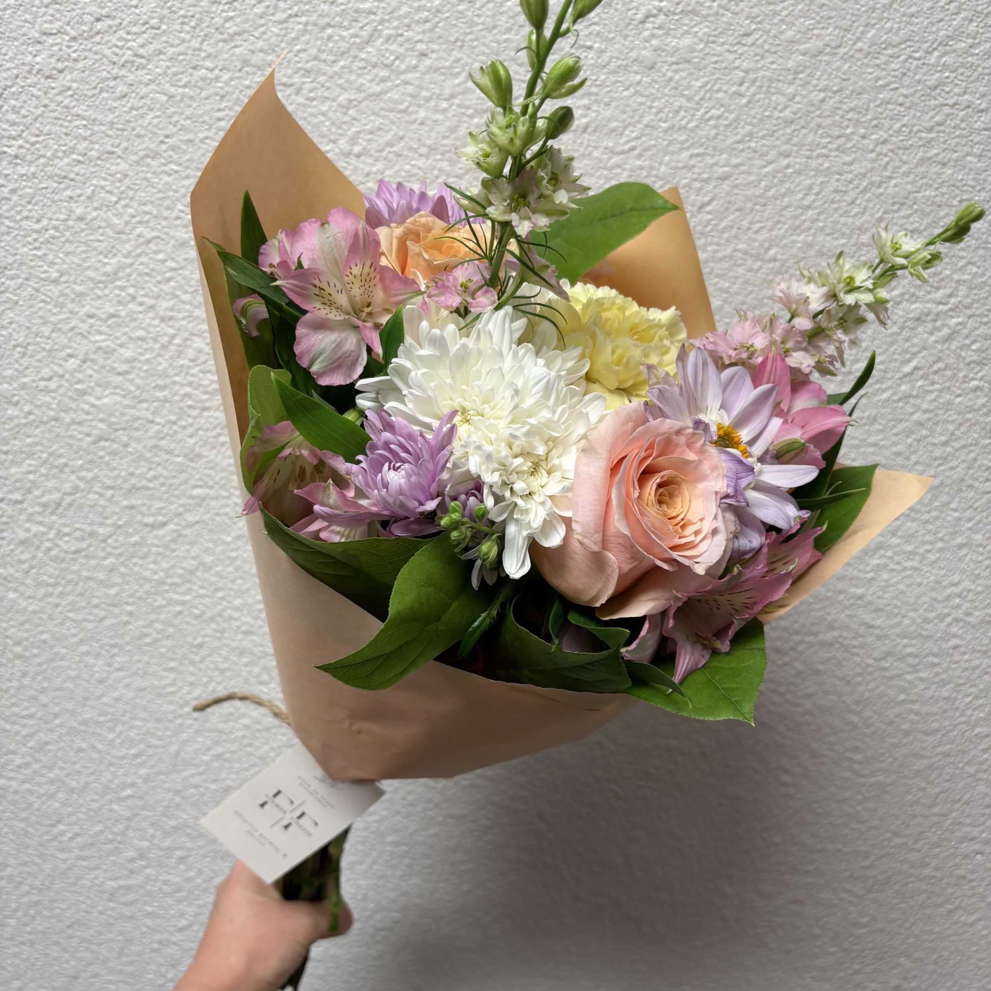 Our signature wraps includes our best, seasonal standard flowers designed and wrapped