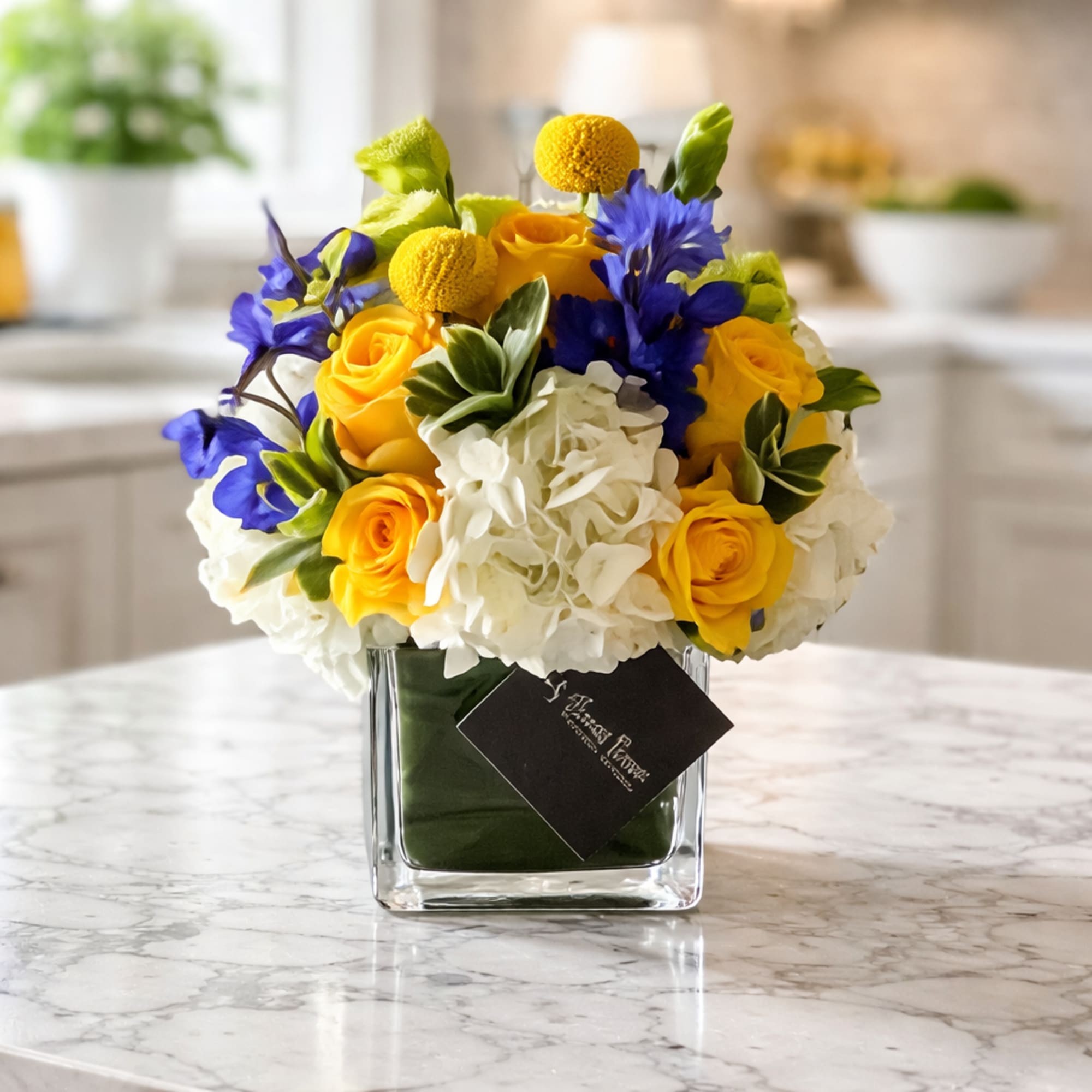 4X4 glass cube arrangement.  Our bluebell arrangement is a mix of