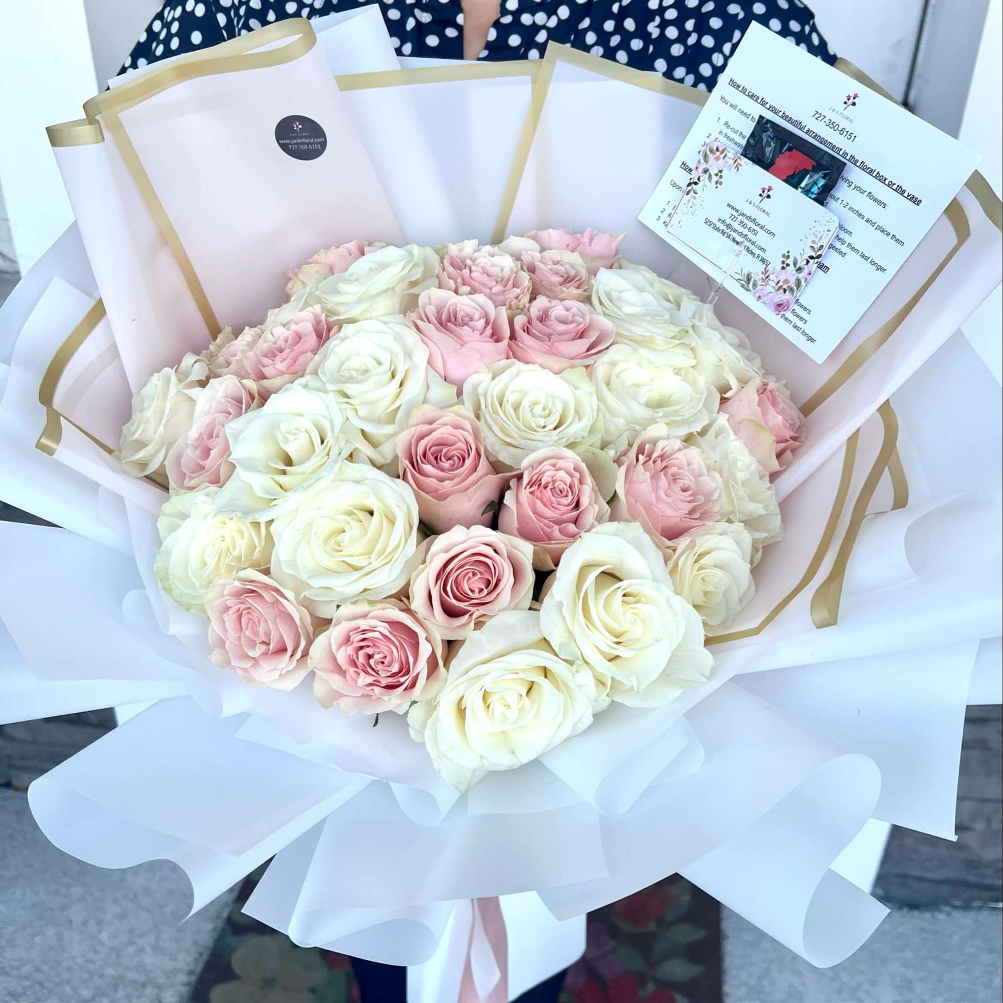 Such an elegant bouquet of pink and white roses, exuding timeless elegance