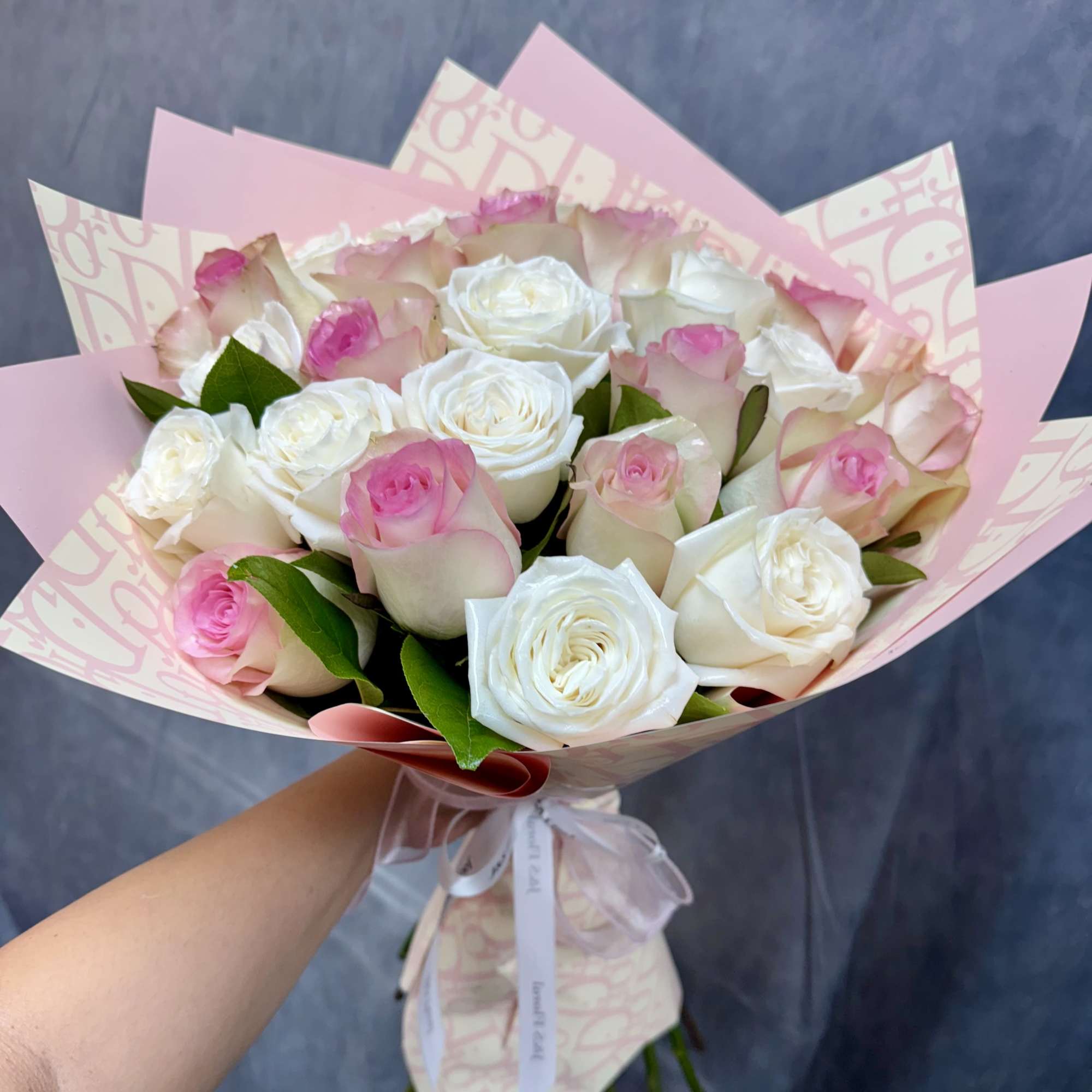 Such an elegant bouquet of pink and white roses, exuding timeless elegance
