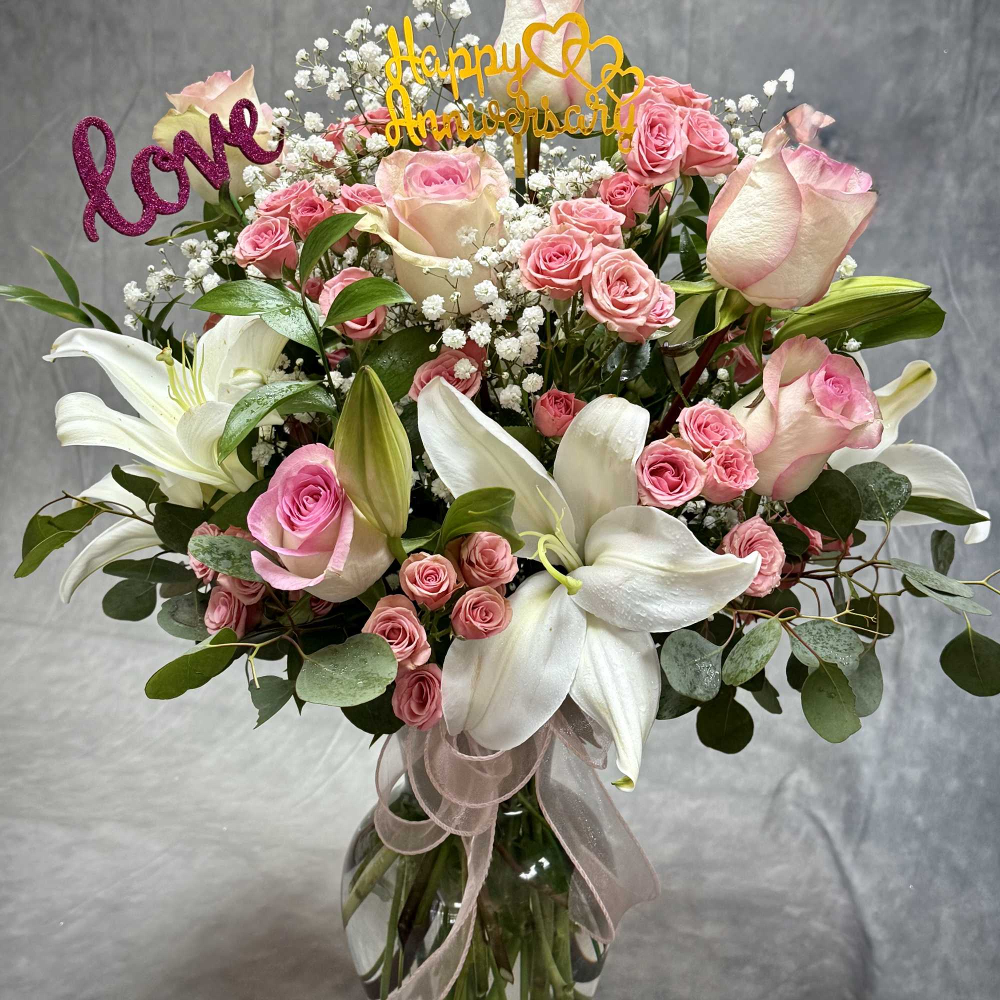 OUR PINK ROSES, LILIES, CARNATION ARRANGEMENTS SPEAK VOLUMES! BEAUTIFULLY HAND MADE IN
