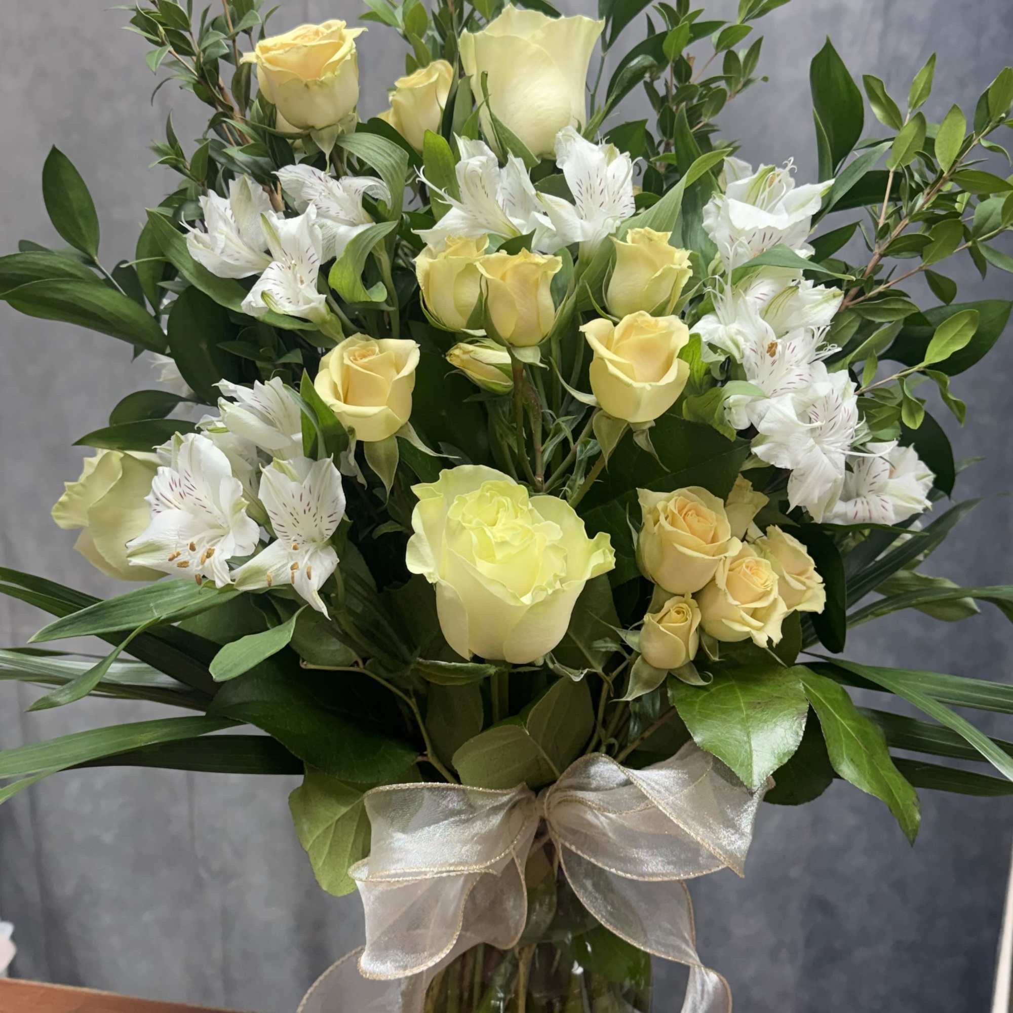 Brighten any day with our handcrafted Peachy Bliss floral arrangements, perfect for