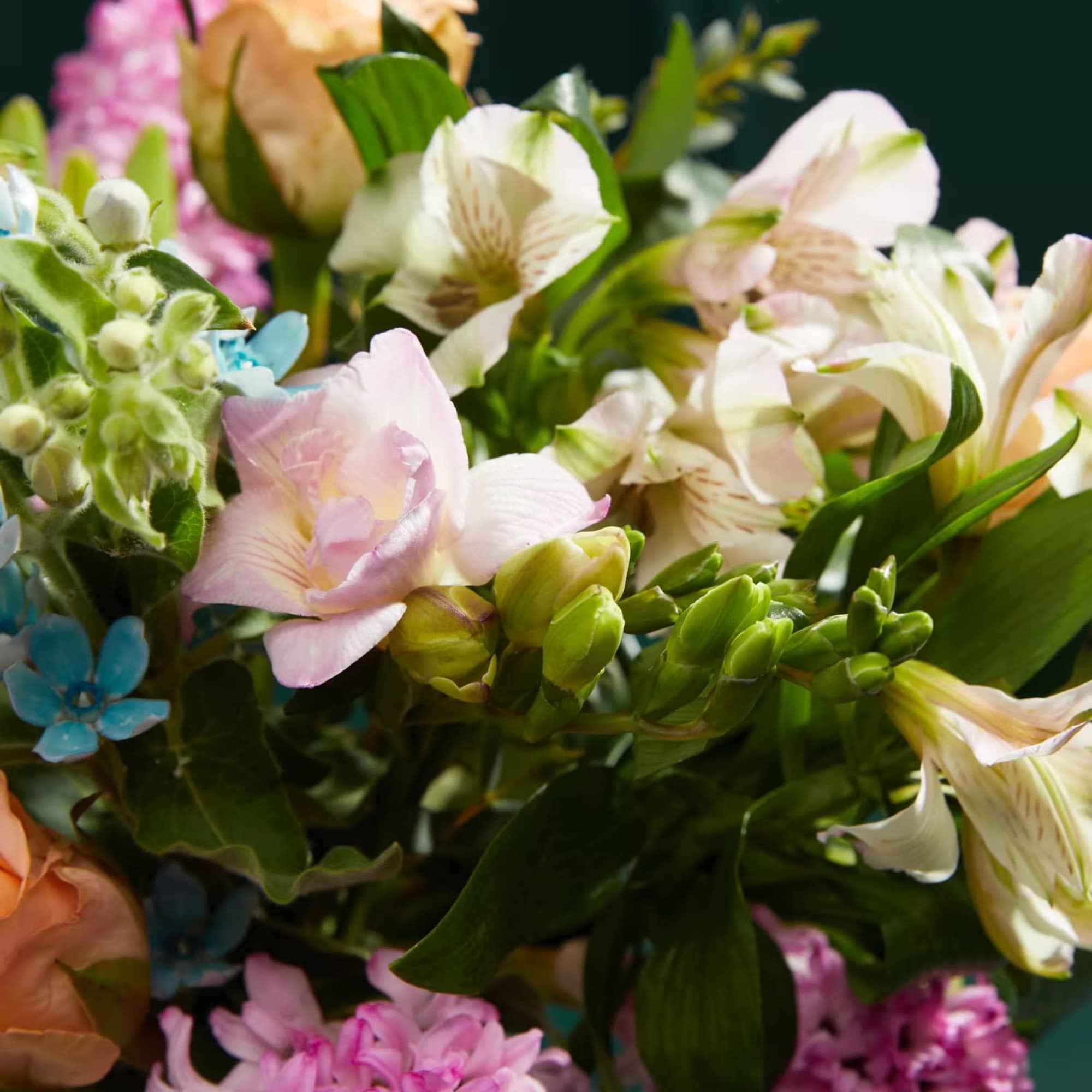 Mixed bouquet with pink, peach, and white flowers