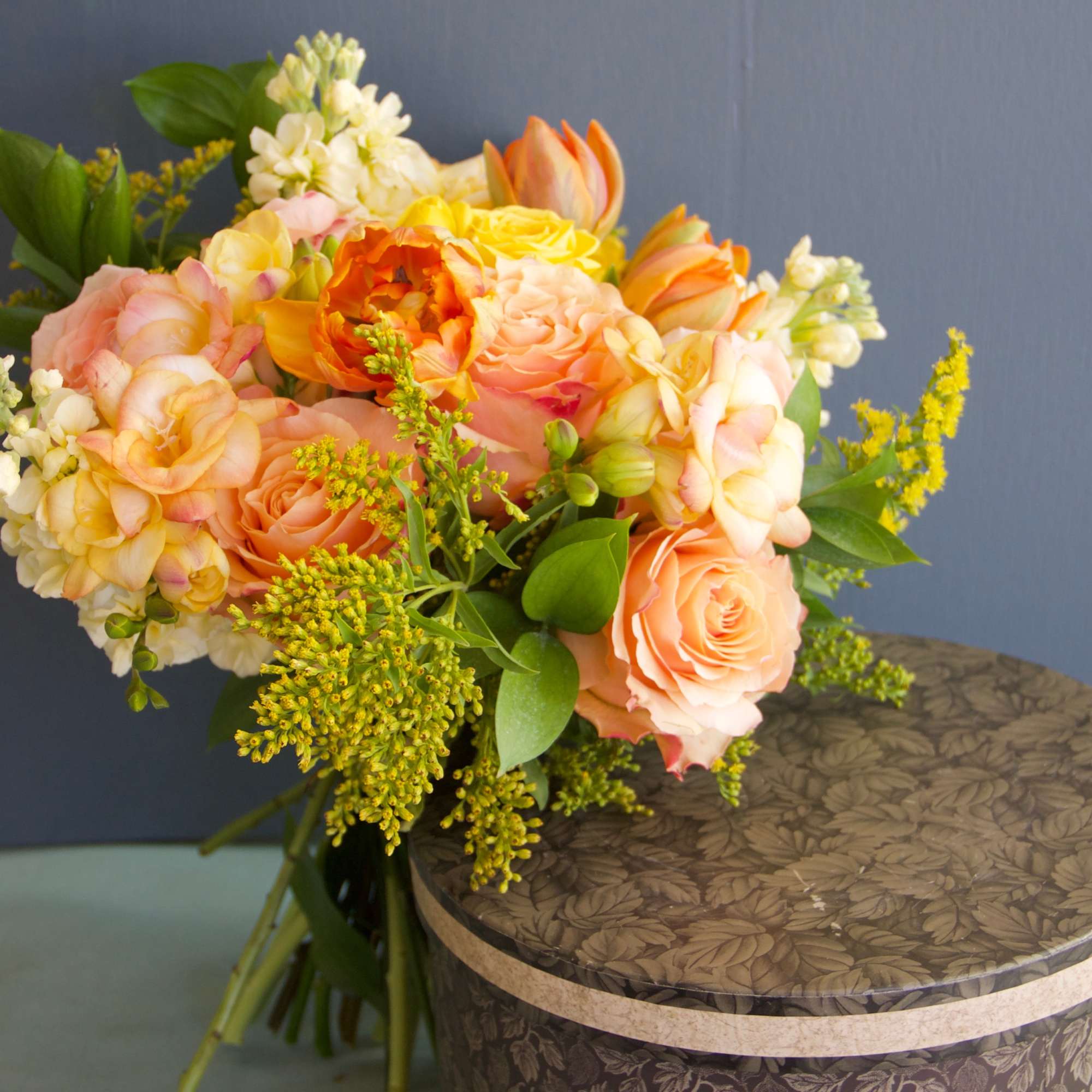 A lovely garden style bouquet in peach and soft yellow tones. Romantic