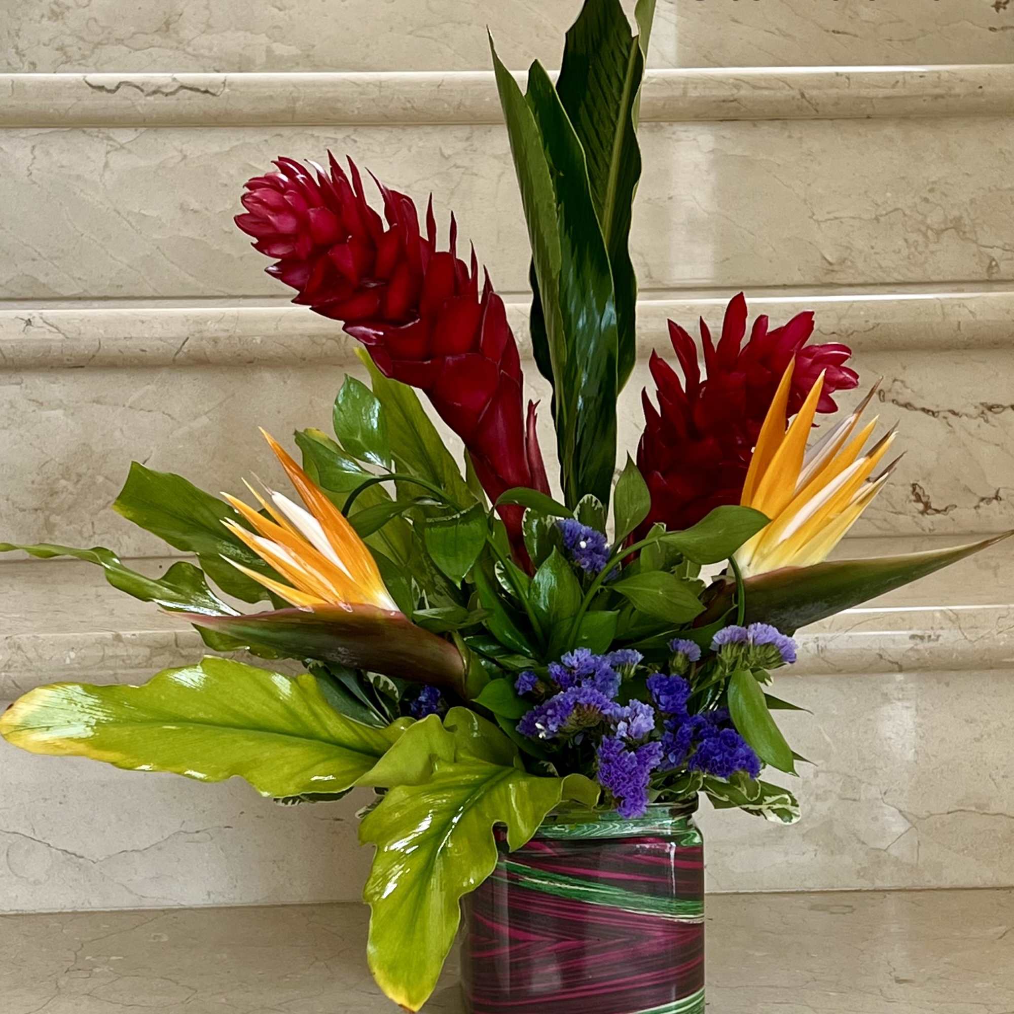 Tropical Flowers as shown arranged in a vase. Deluxe version has more