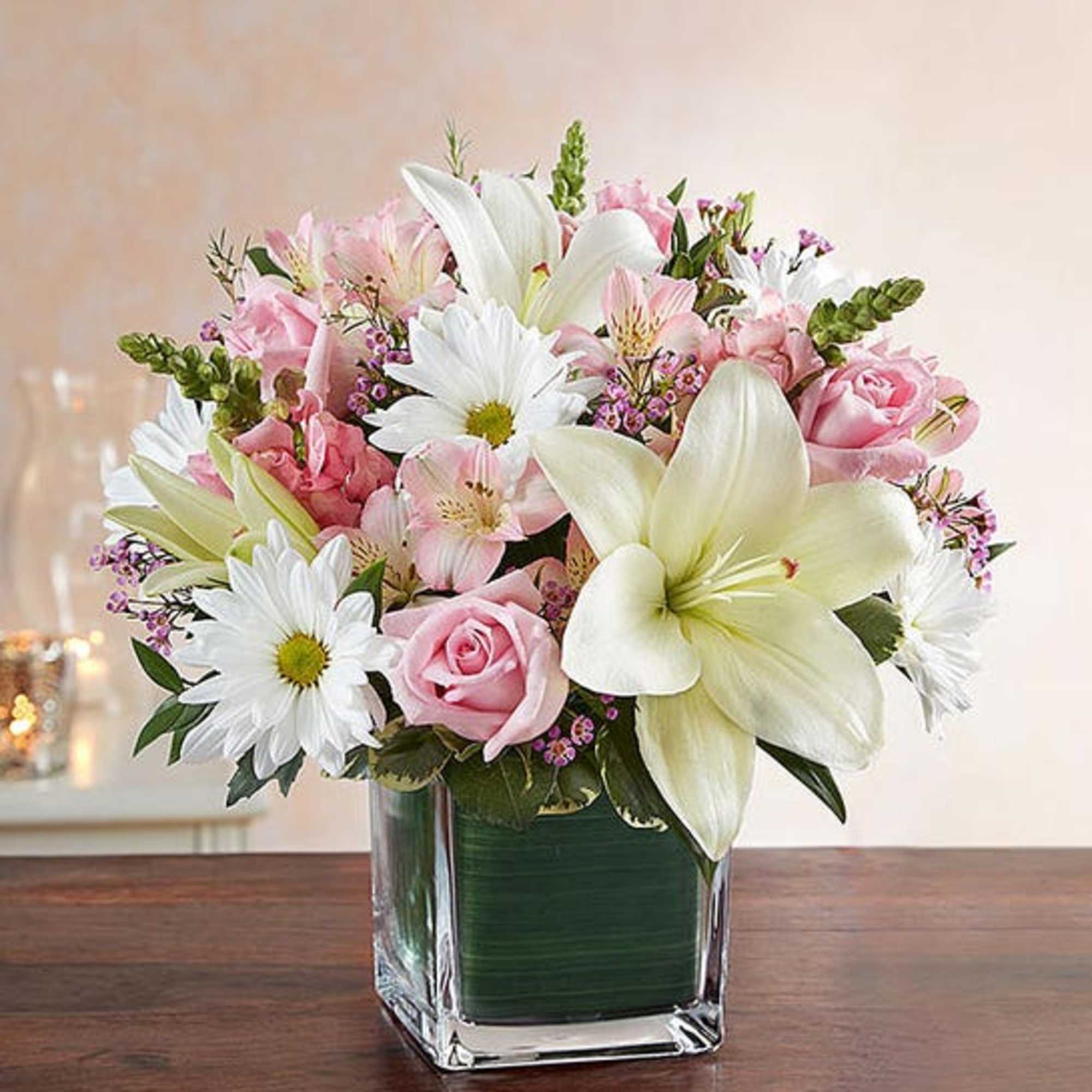 The elegant of our pink and white arrangement conveys your heartfelt condolences