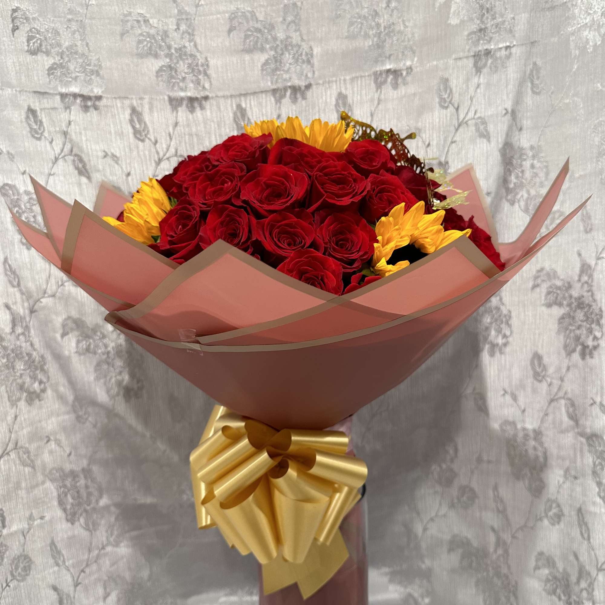 Standard:50 Red Roses and 5 Sunflower and choice of color wrapping paper
Deluxe: