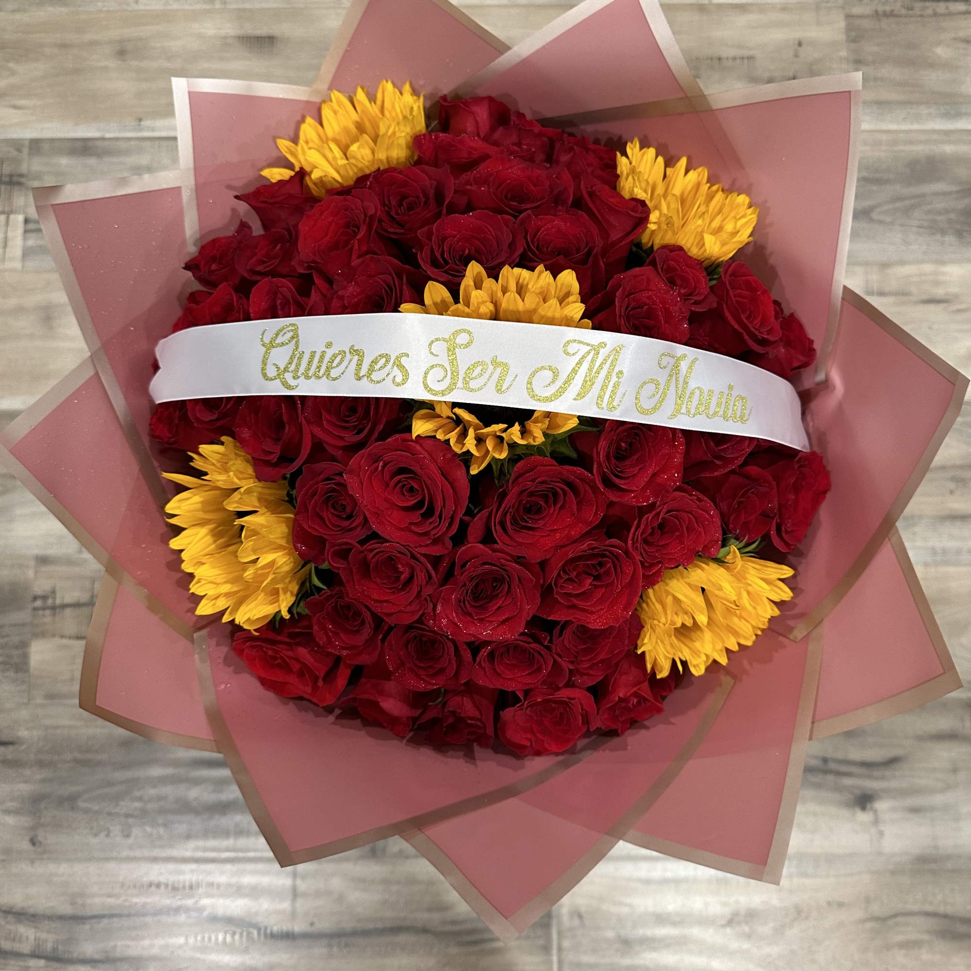 Standard:50 Red Roses and 5 Sunflower and choice of color wrapping paper
Deluxe: