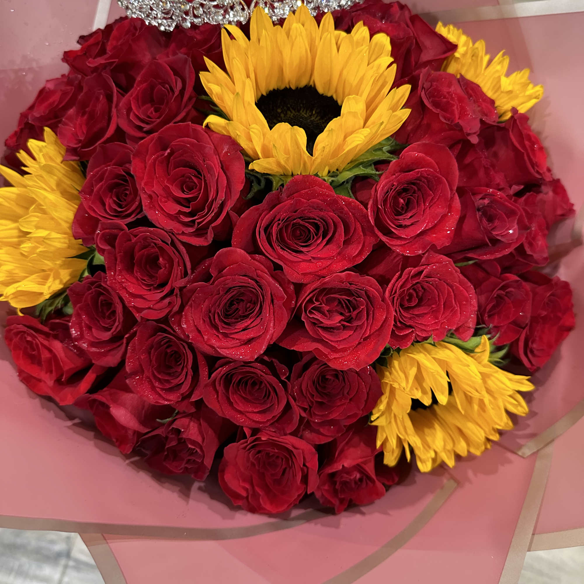 Standard:50 Red Roses and 5 Sunflower and choice of color wrapping paper
Deluxe: