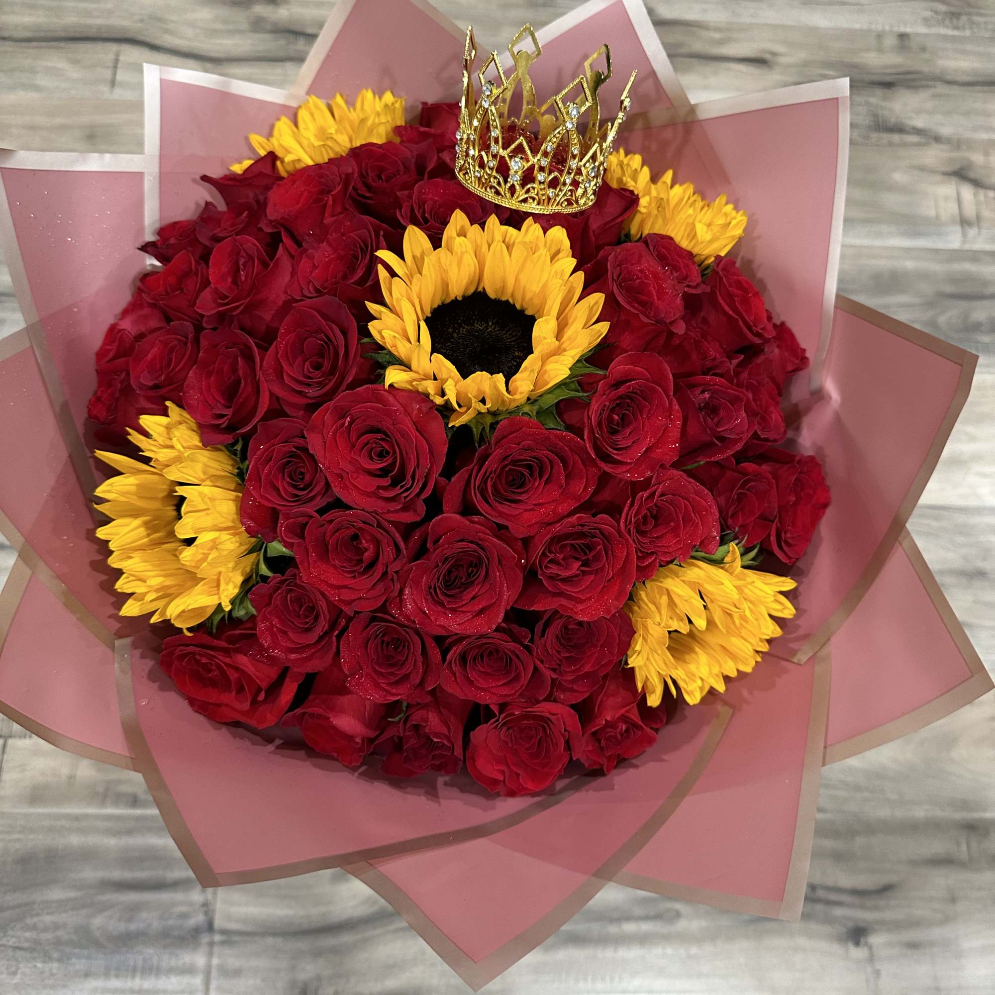 Standard:50 Red Roses and 5 Sunflower and choice of color wrapping paper
Deluxe: