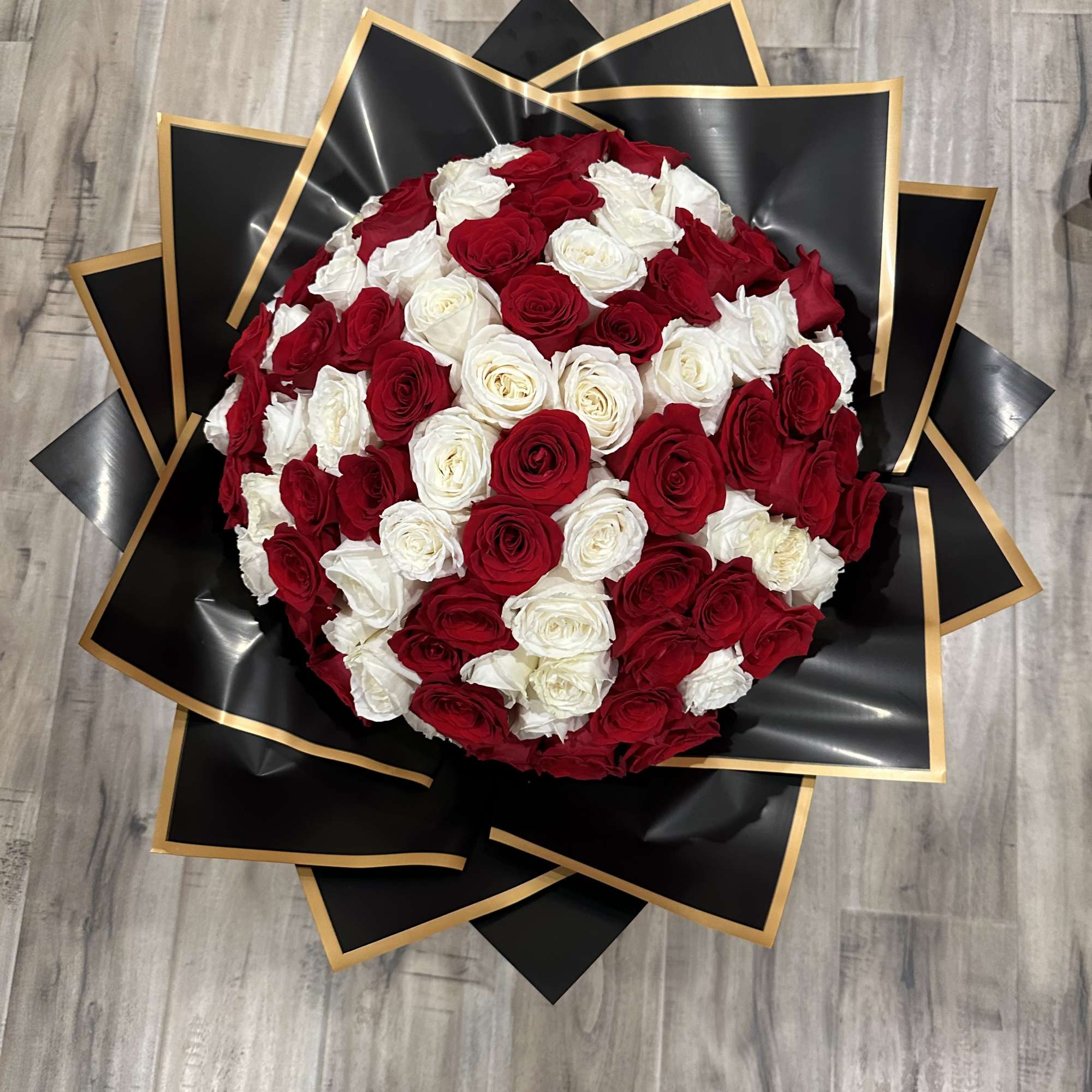 Surprise your love one with a 100 rose bouquet to win your