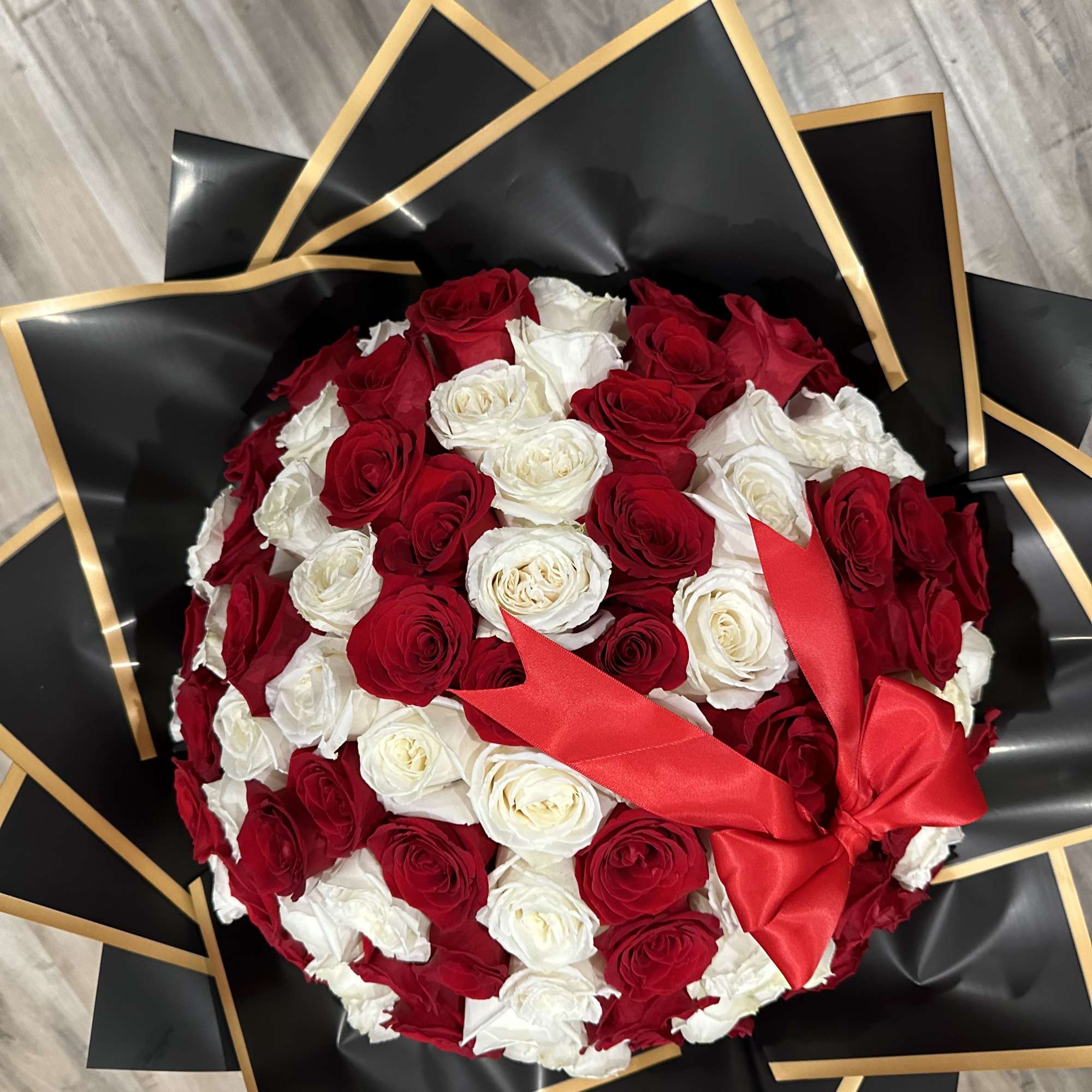 Surprise your love one with a 100 rose bouquet to win your