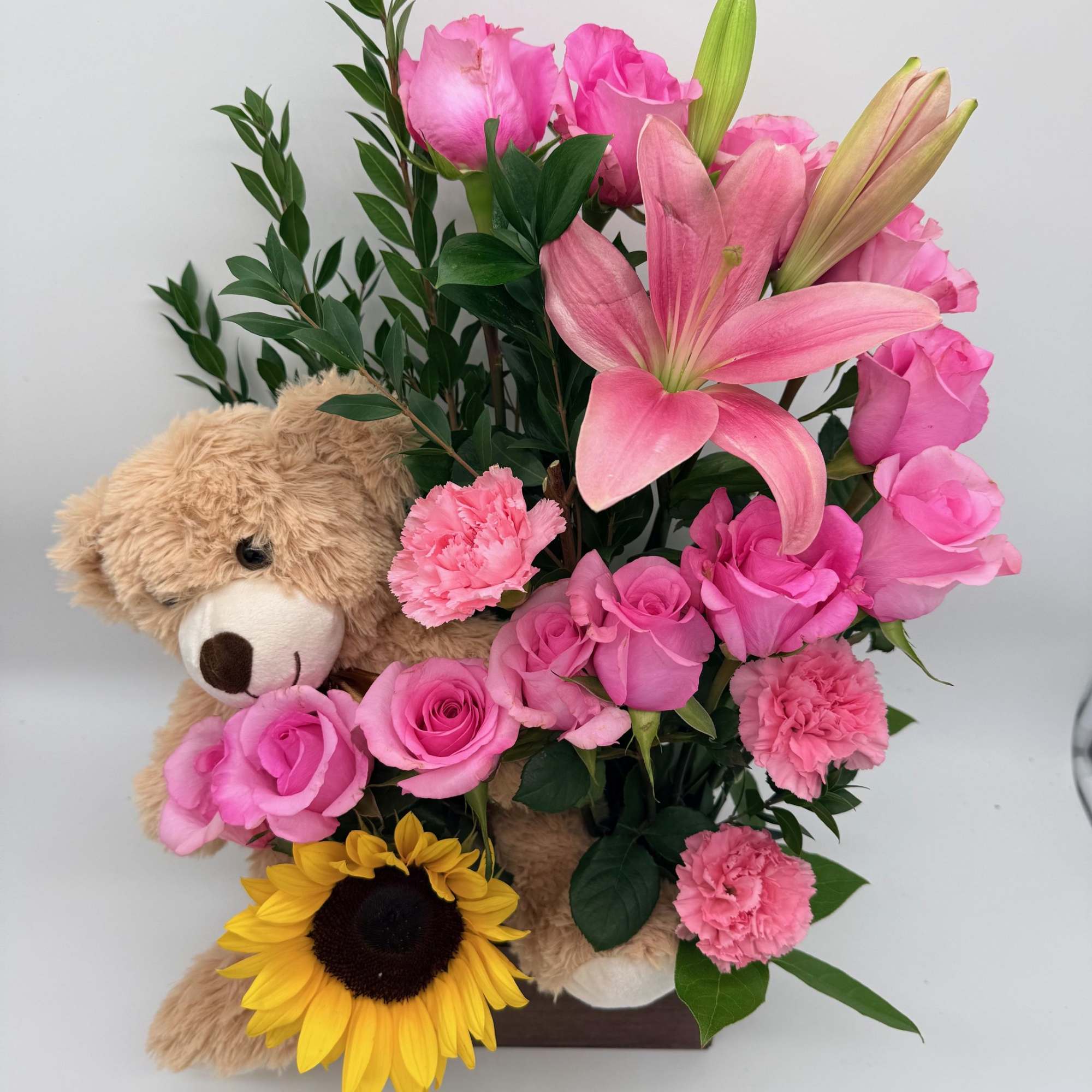 Send smiles in the sweetest way! This adorable wooden box arrangement features