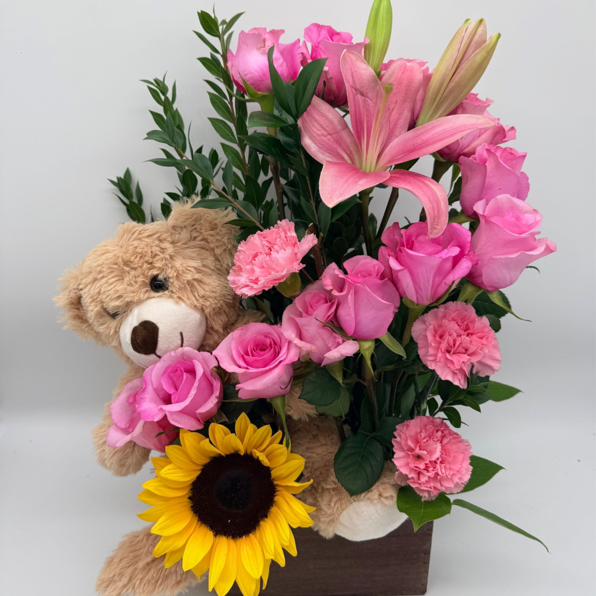 Send smiles in the sweetest way! This adorable wooden box arrangement features