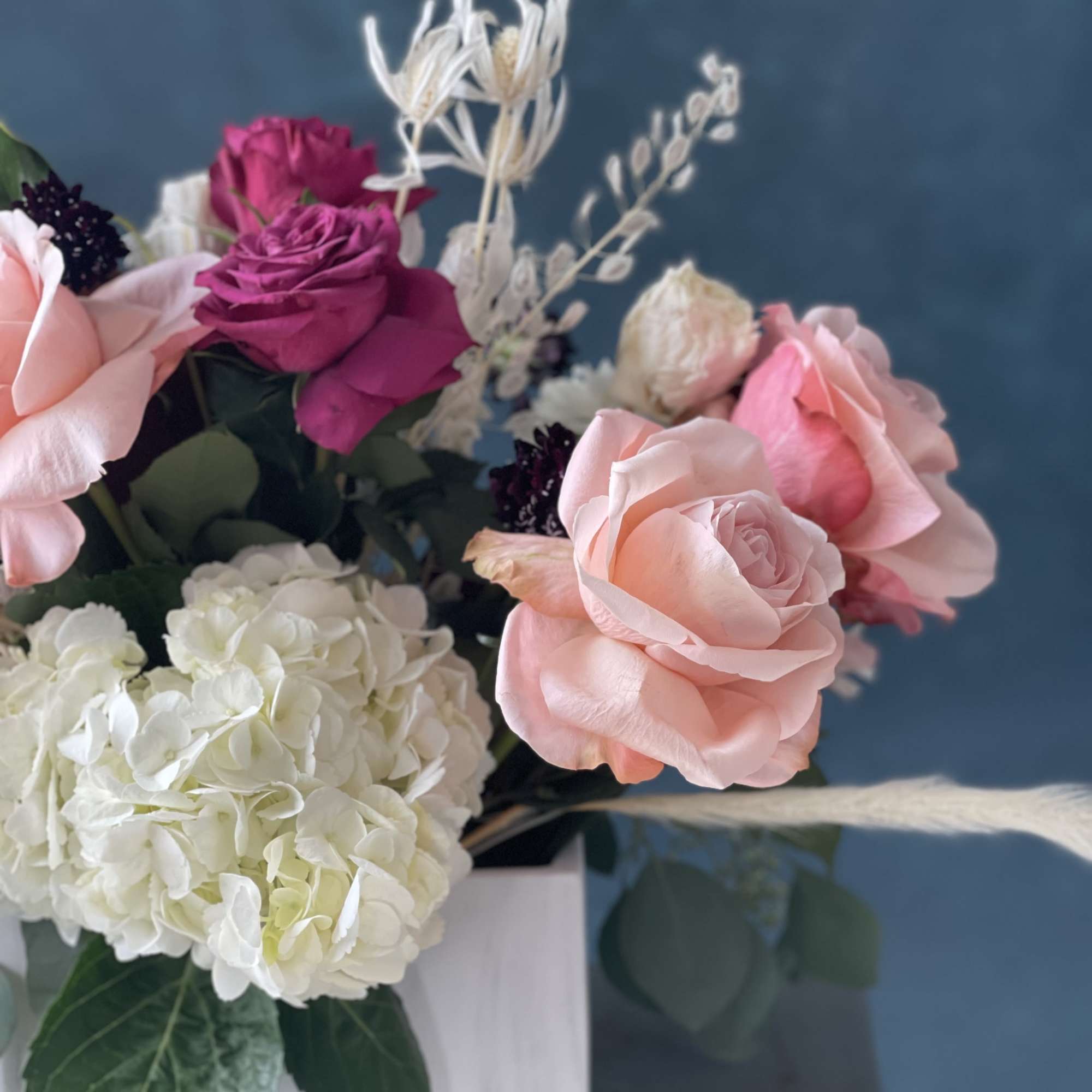 12 stunning rose- colors Will vary. Color scheme will remain the same.