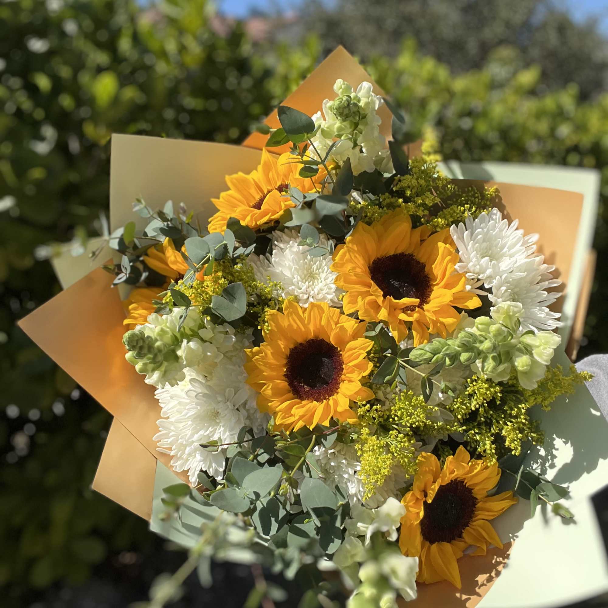 Sunshine Bloom is a joyful, radiant bouquet designed to brighten any day.