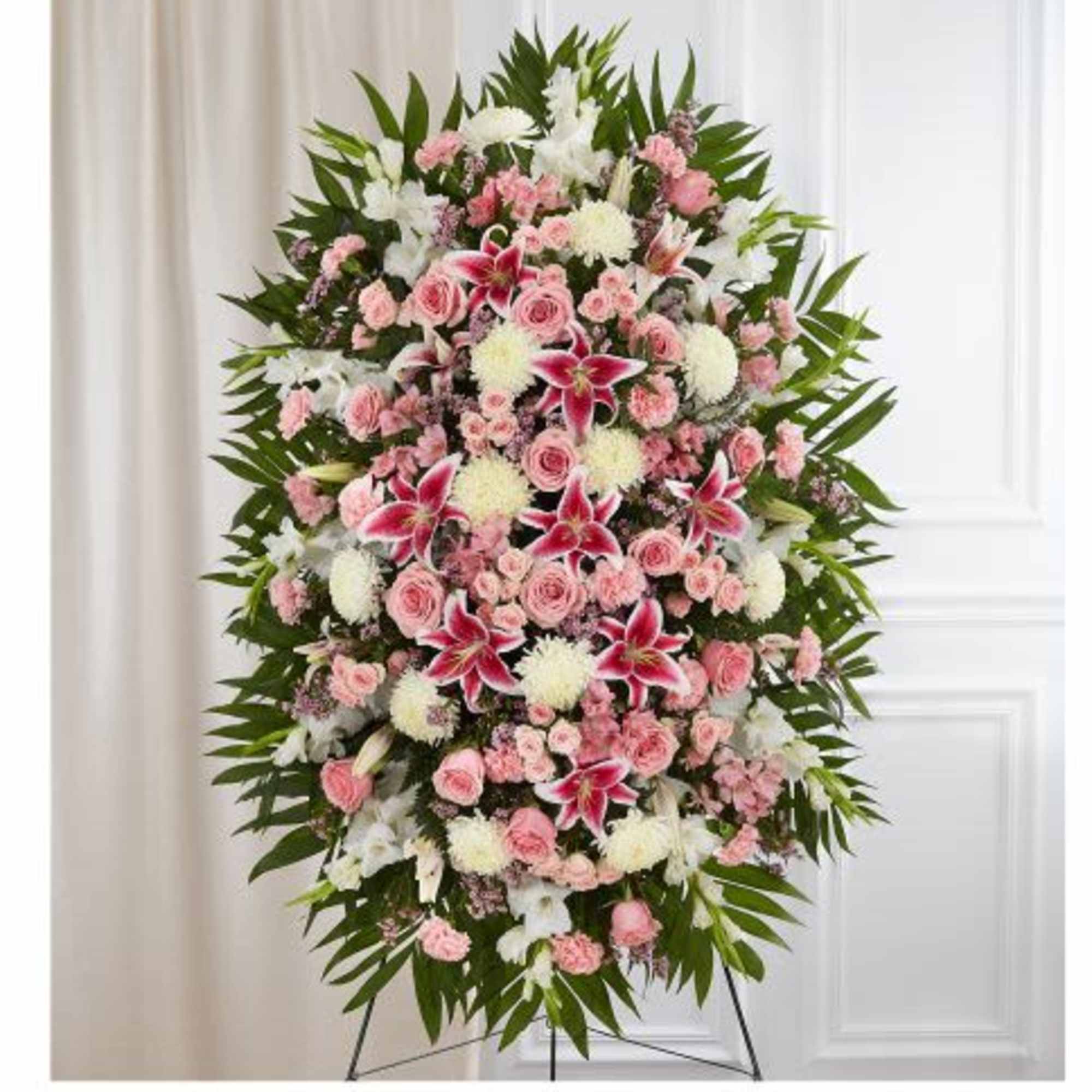 Arrangement with pink and white flowers, accented with soft, lush greenery