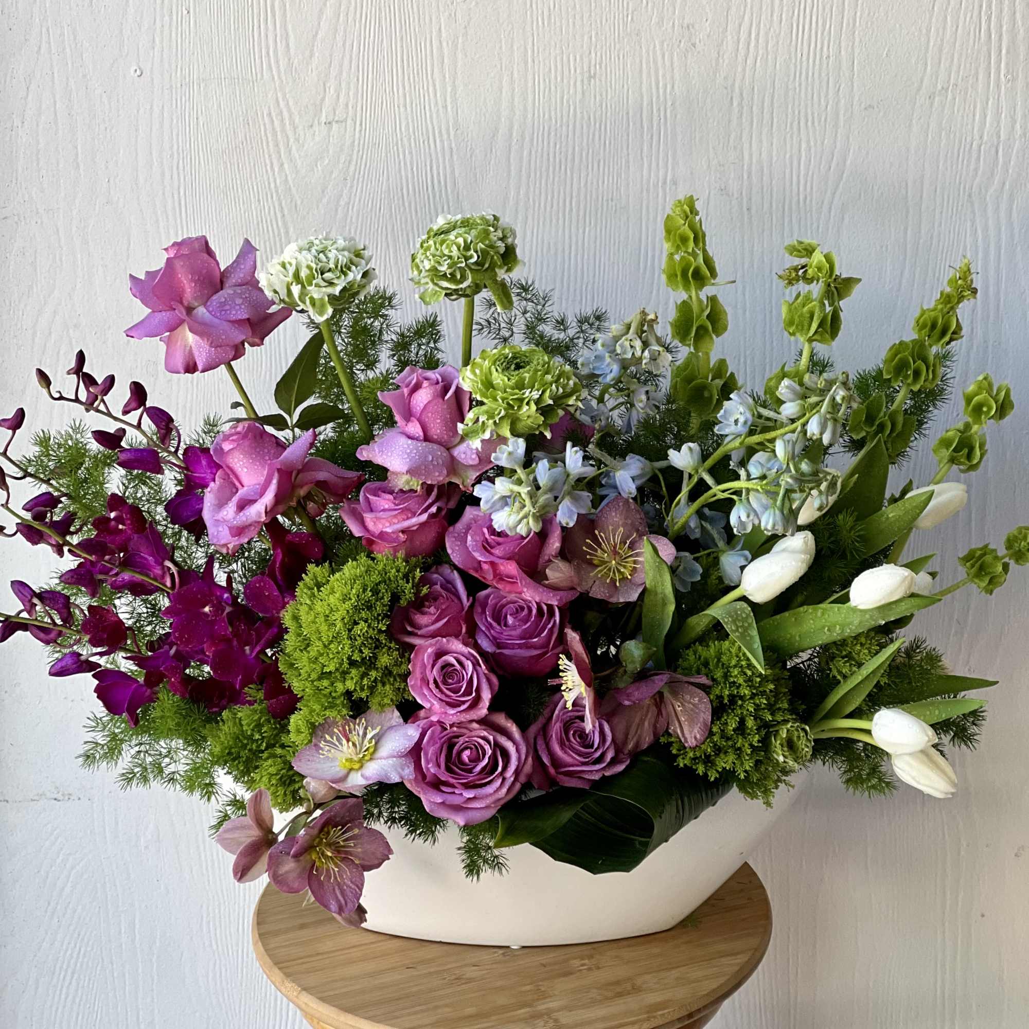 This stunning flower arrangement is designed to be long and elegant, making