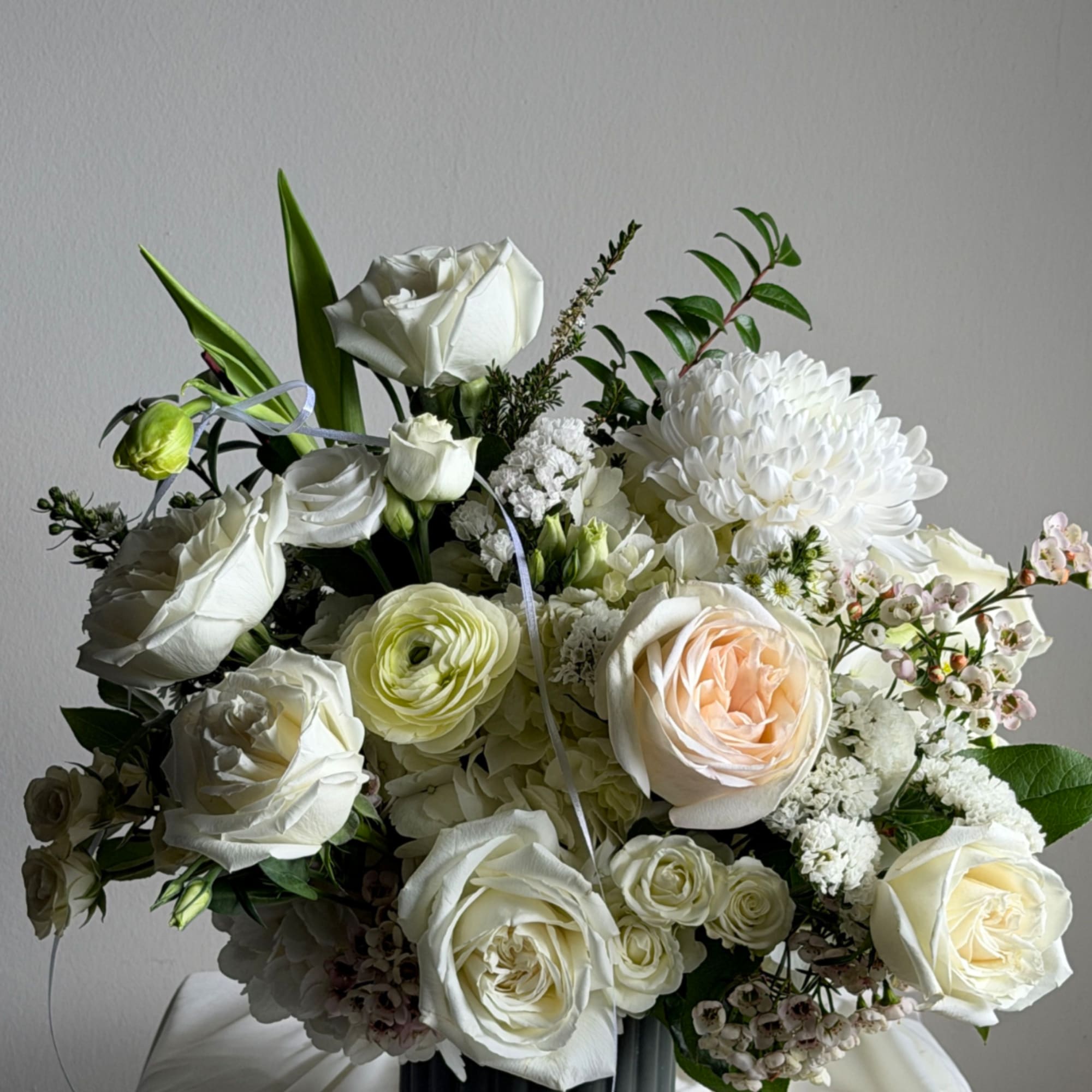 a not so classic Vase elegantly decorated with white flowers, a beautiful