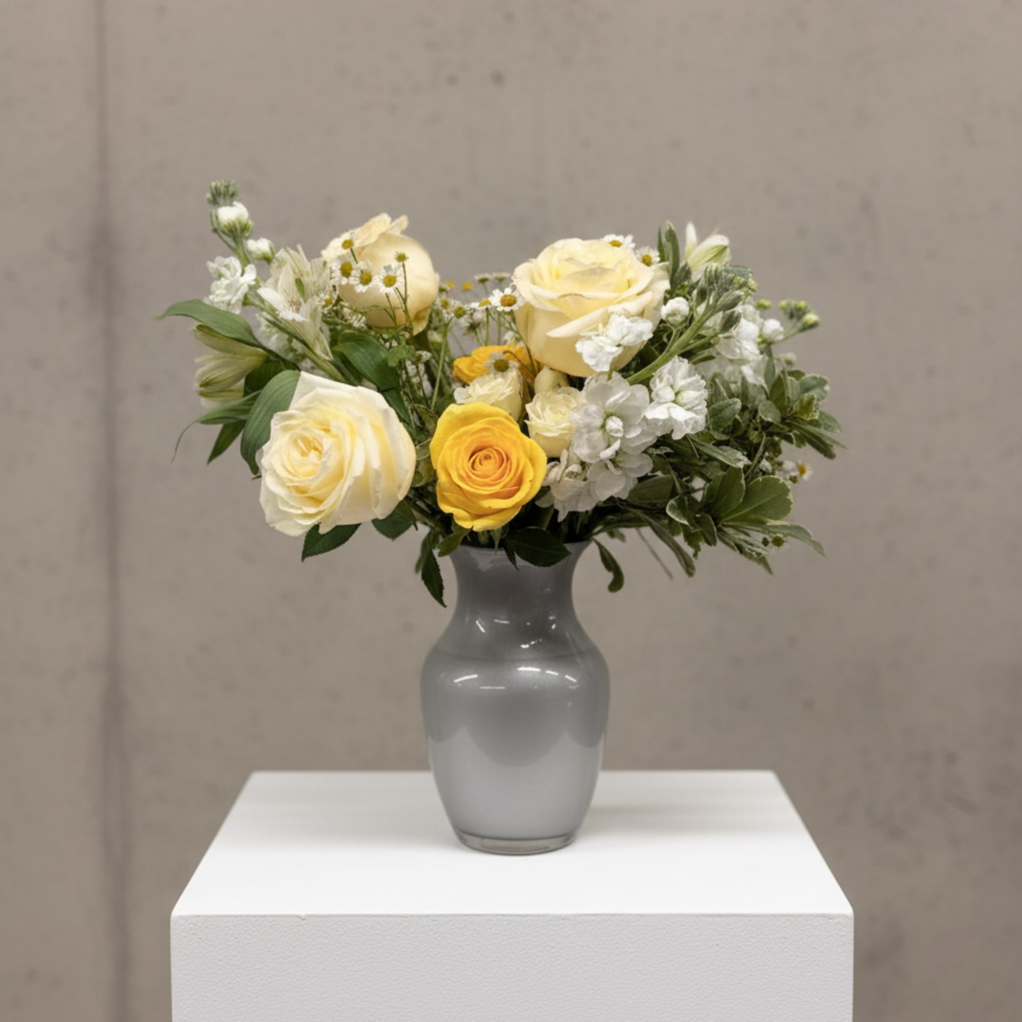 This fun and bright arrangement is perfect for the holidays and matches