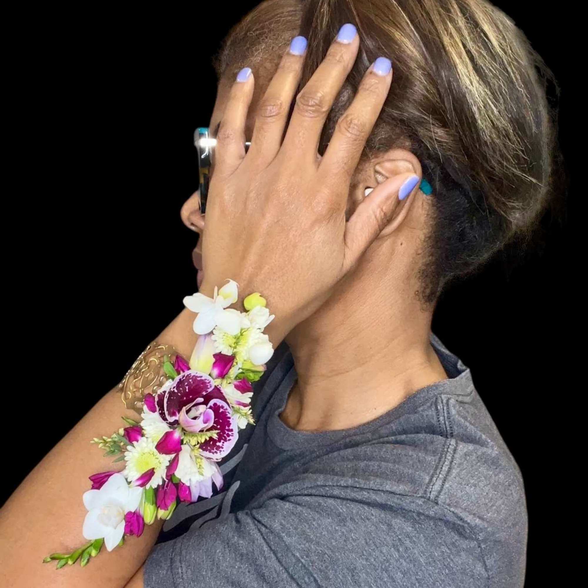 Make a statement with this stunning handcrafted corsage, designed with a vibrant