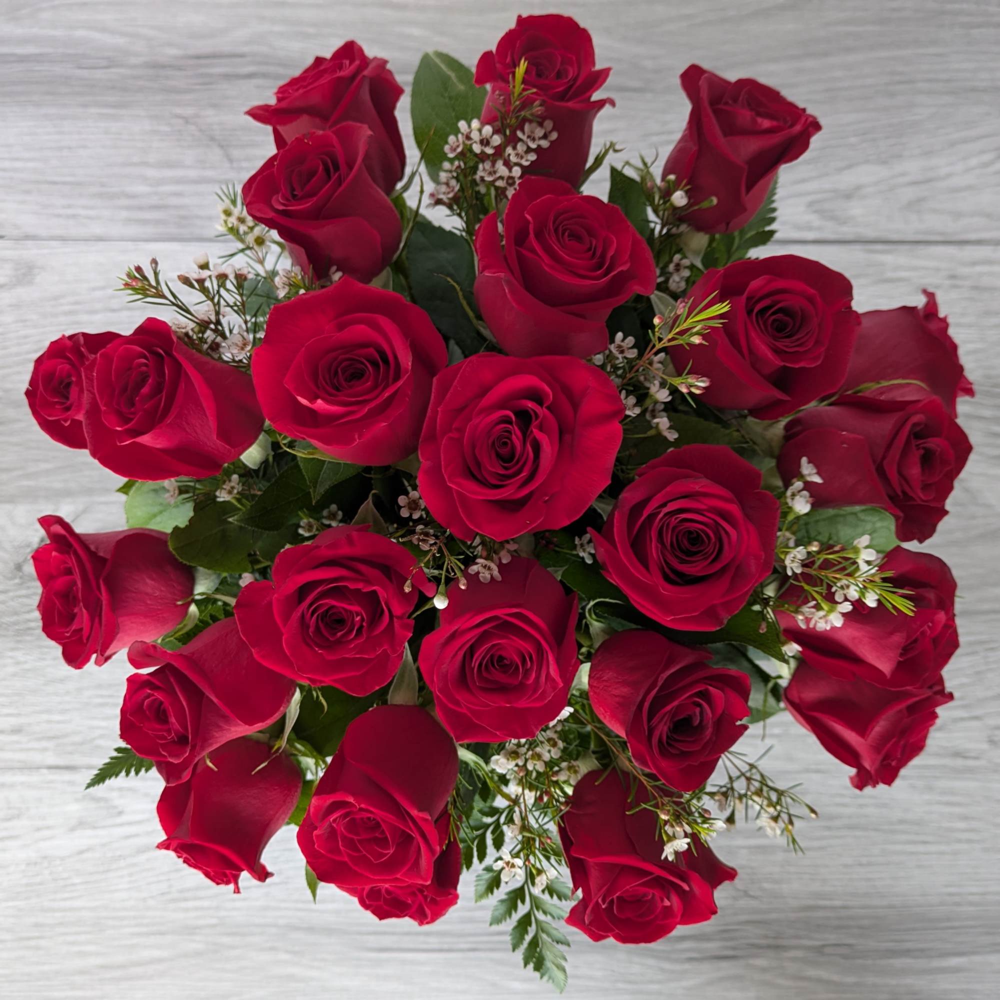 Twenty-four Medium Stemmed Roses is A Ladybug Floral exclusive bouquet. This bouquet